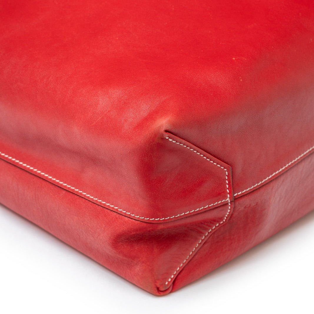 Close-up of corner stitching and smooth leather detail on Hermès Double Sens 45 Rouge/Bicolor Swift bag