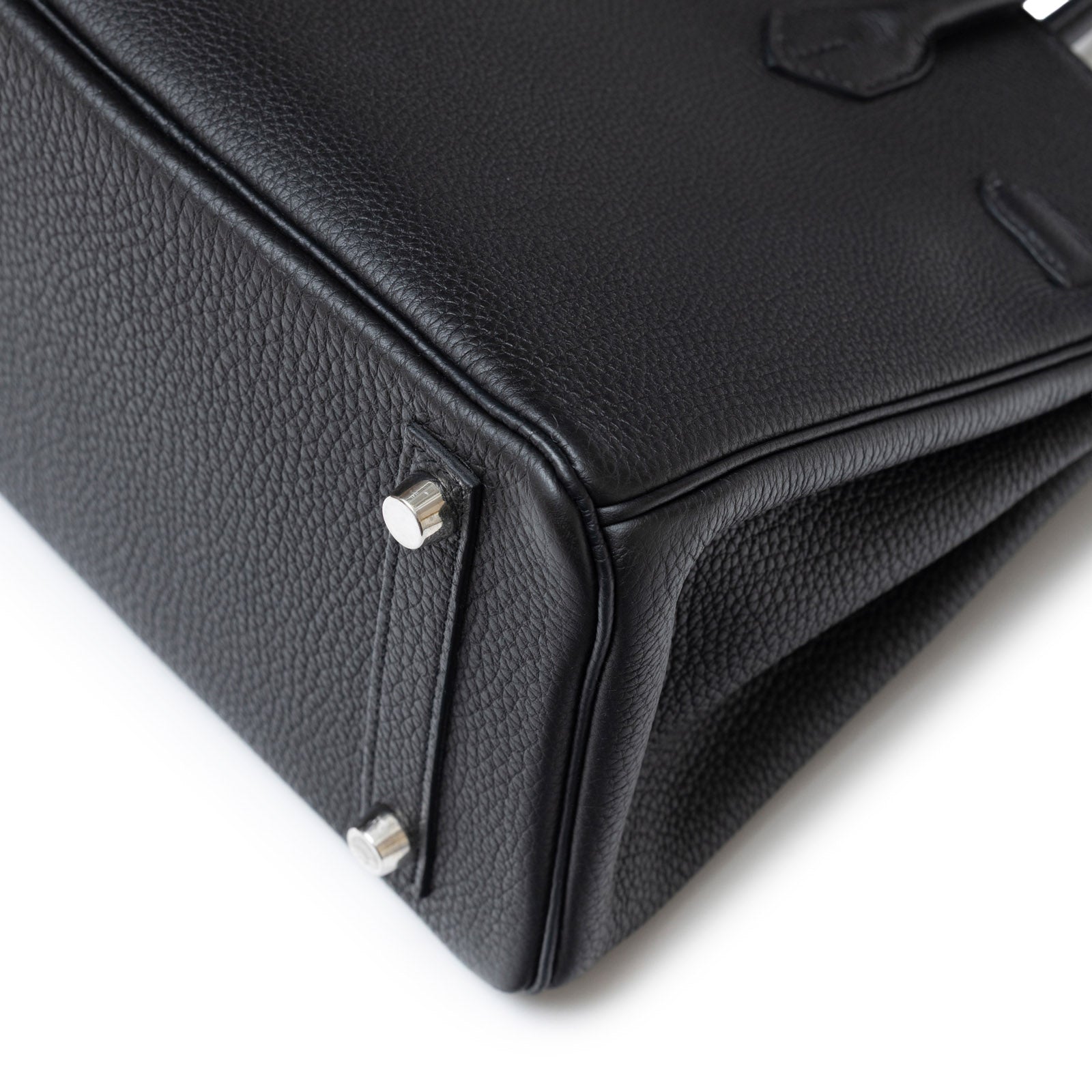 Close-up of bottom corner showing texture and palladium hardware on Hermès Birkin 25 Black Togo Palladium Hardware