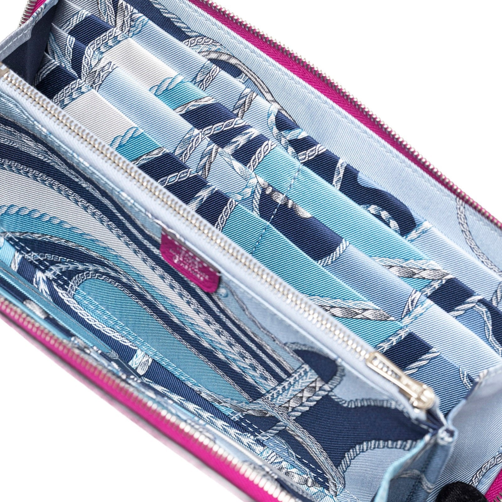 Interior close-up of Hermès Silk'In Classique Long Wallet Rose Pourpre/Blue Epsom Palladium Hardware showing patterned fabric lining and compartments
