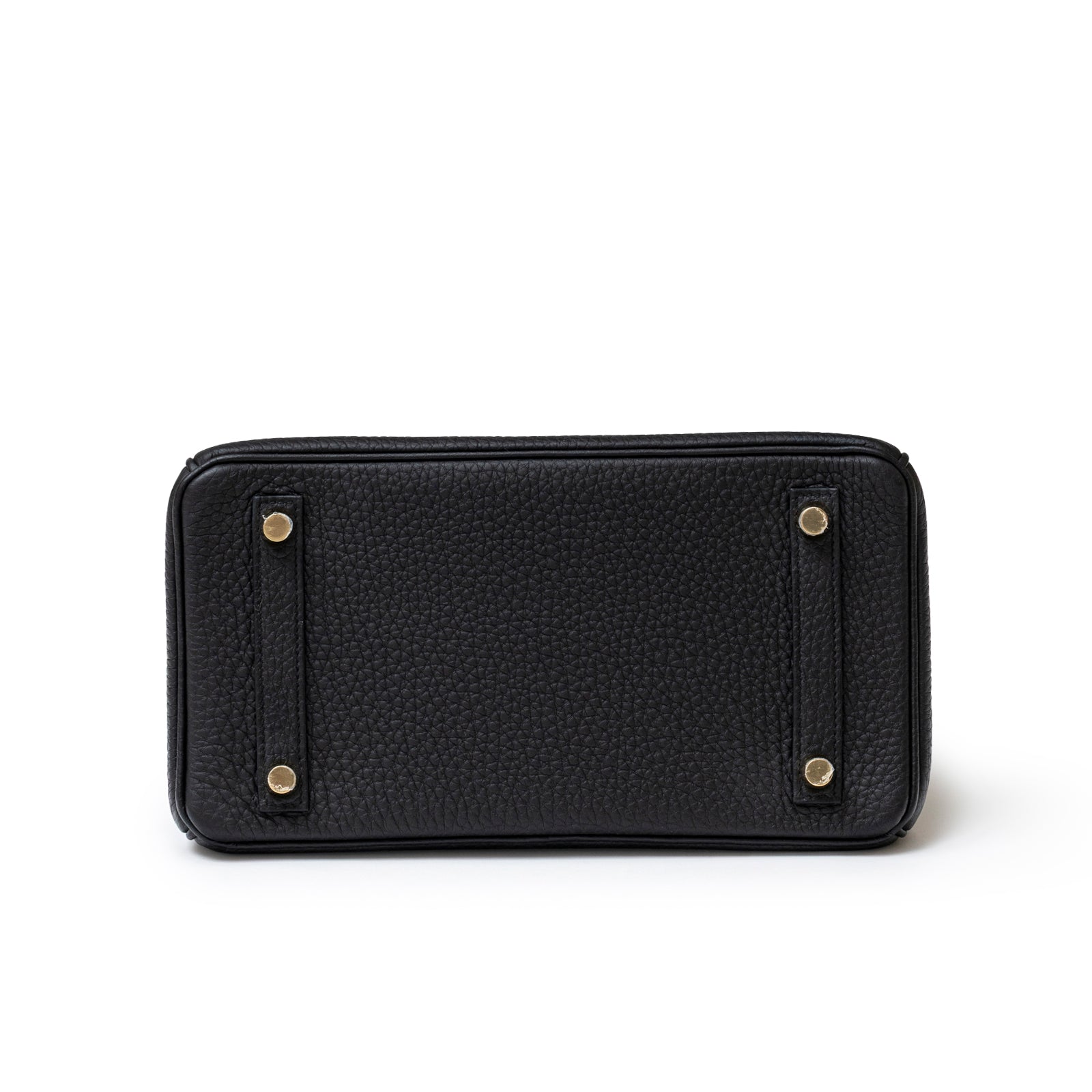Bottom view of Hermès Birkin 25 Black Togo Gold Hardware showing textured leather and gold feet hardware details