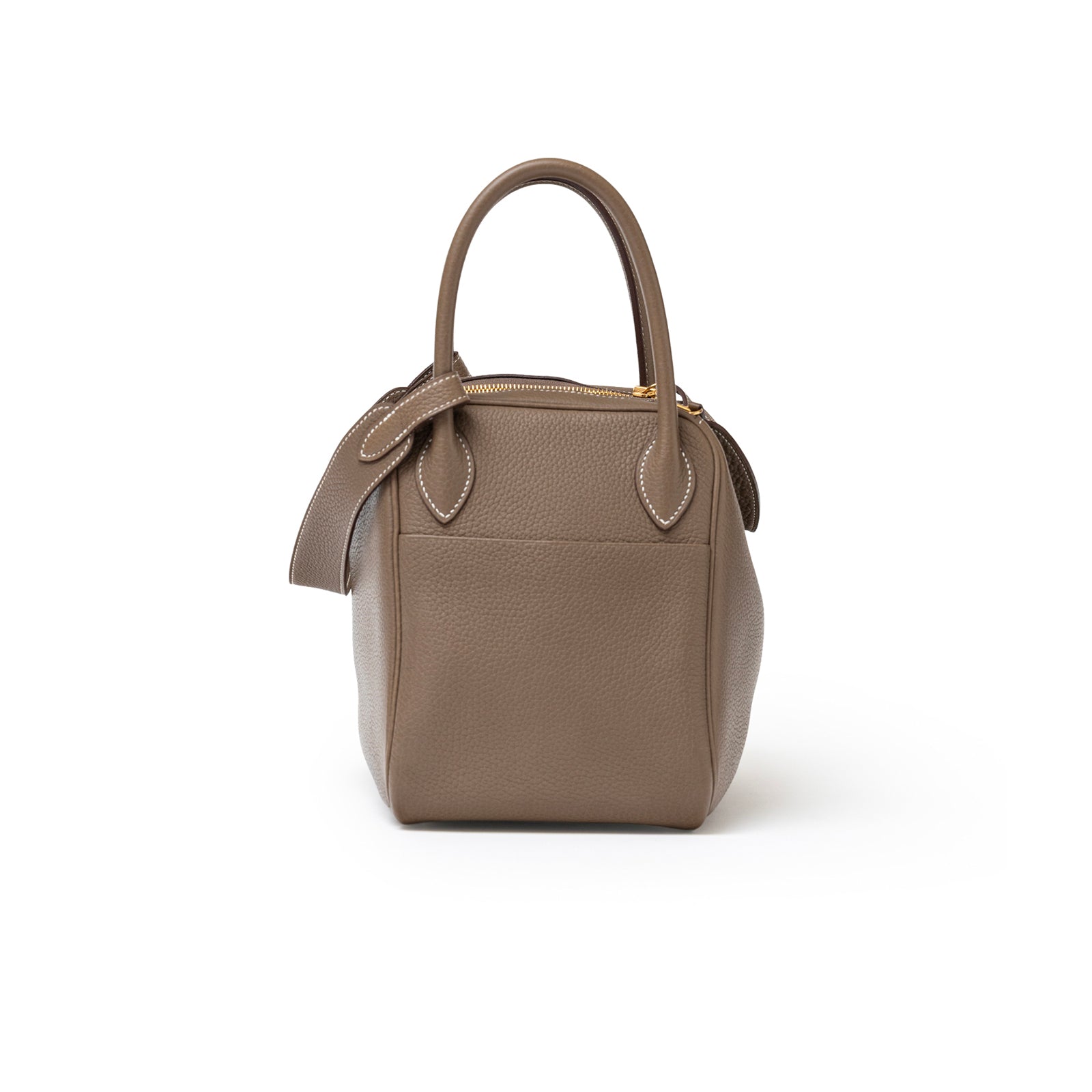 Front view of Hermès Lindy 30 Etoupe Clemence Gold Hardware in taupe leather with stitched handles and zip closure