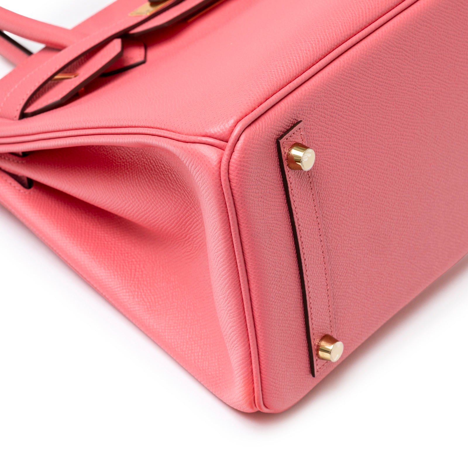 Close-up bottom view of Hermès Special Order Horseshoe Stamp Birkin 30 Rose Azalee Epsom Gold Hardware showing leather texture and studs.