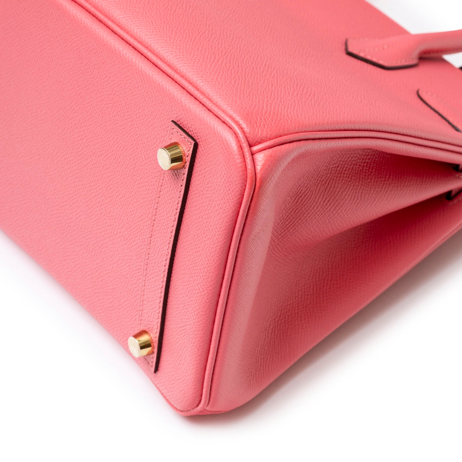 Close-up bottom view of Hermès Special Order Horseshoe Stamp Birkin 30 Rose Azalee Epsom Gold Hardware showing feet and stitching details