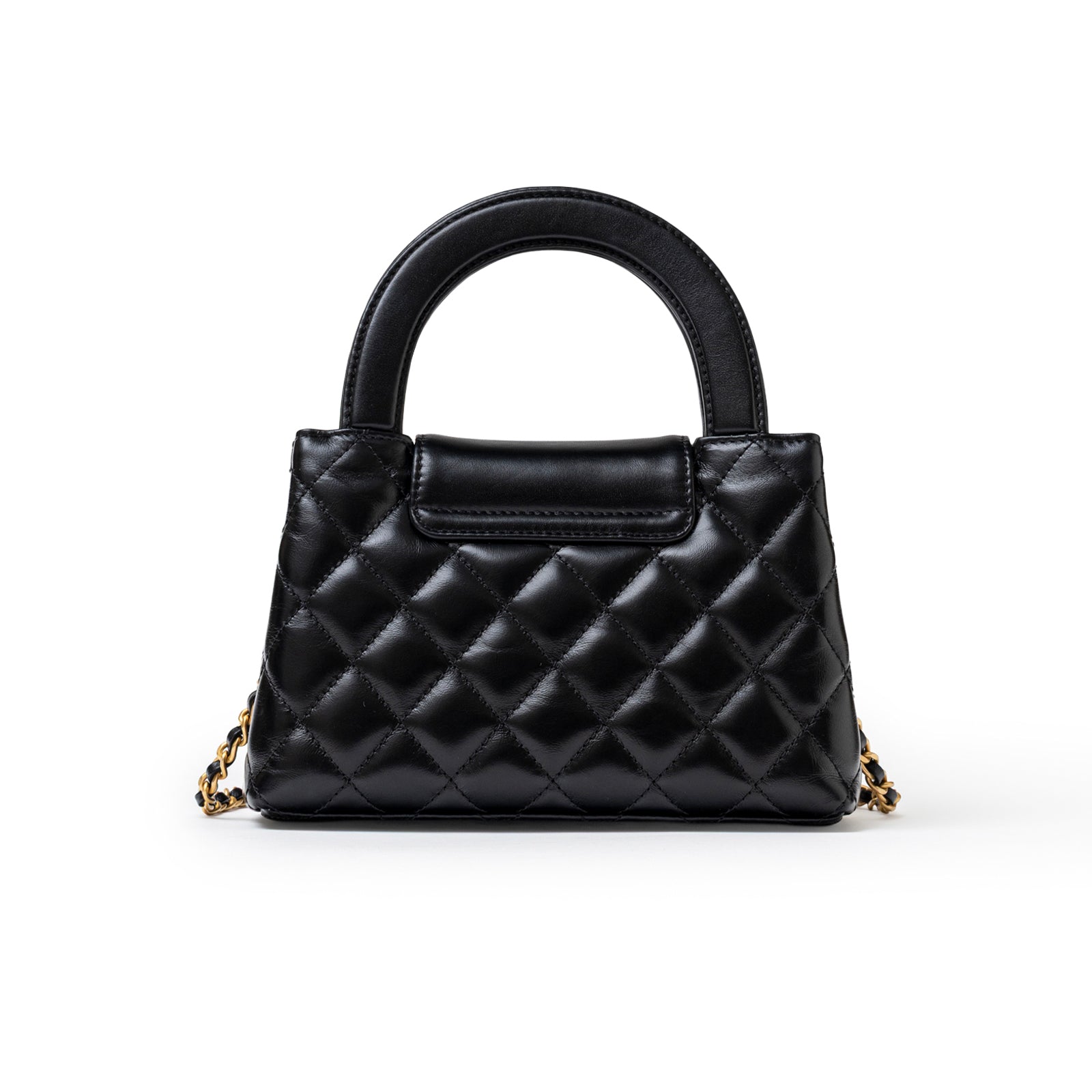 Front view of Chanel Mini Kelly Shopper Black Shiny Aged Calfskin Brushed Gold Hardware with quilted design and smooth handle