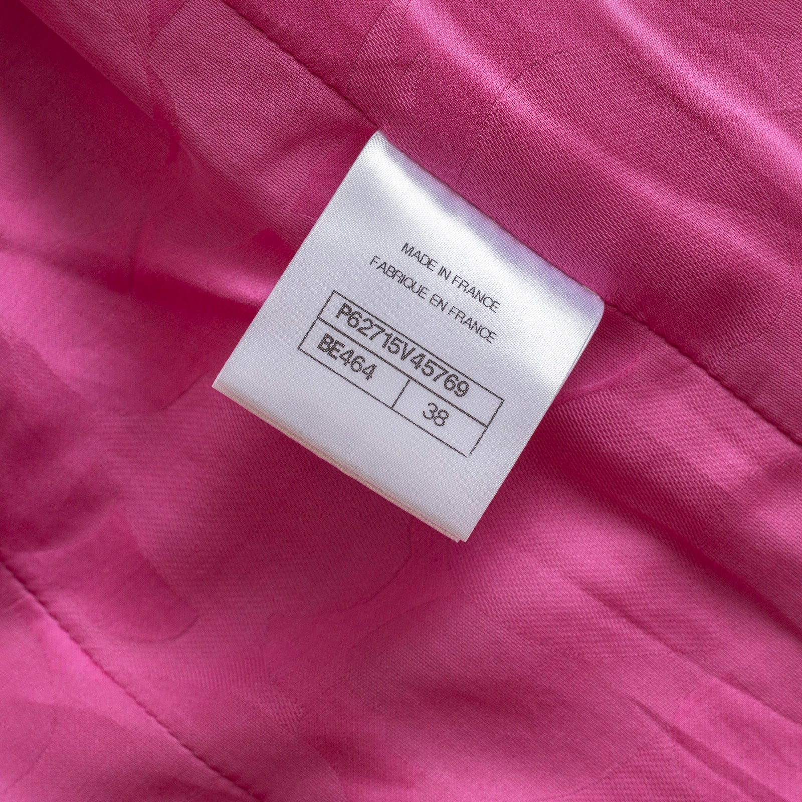 Close-up of inside label showing size and origin on Chanel Tweed Jacket Victoria Ceretti Fushia lining