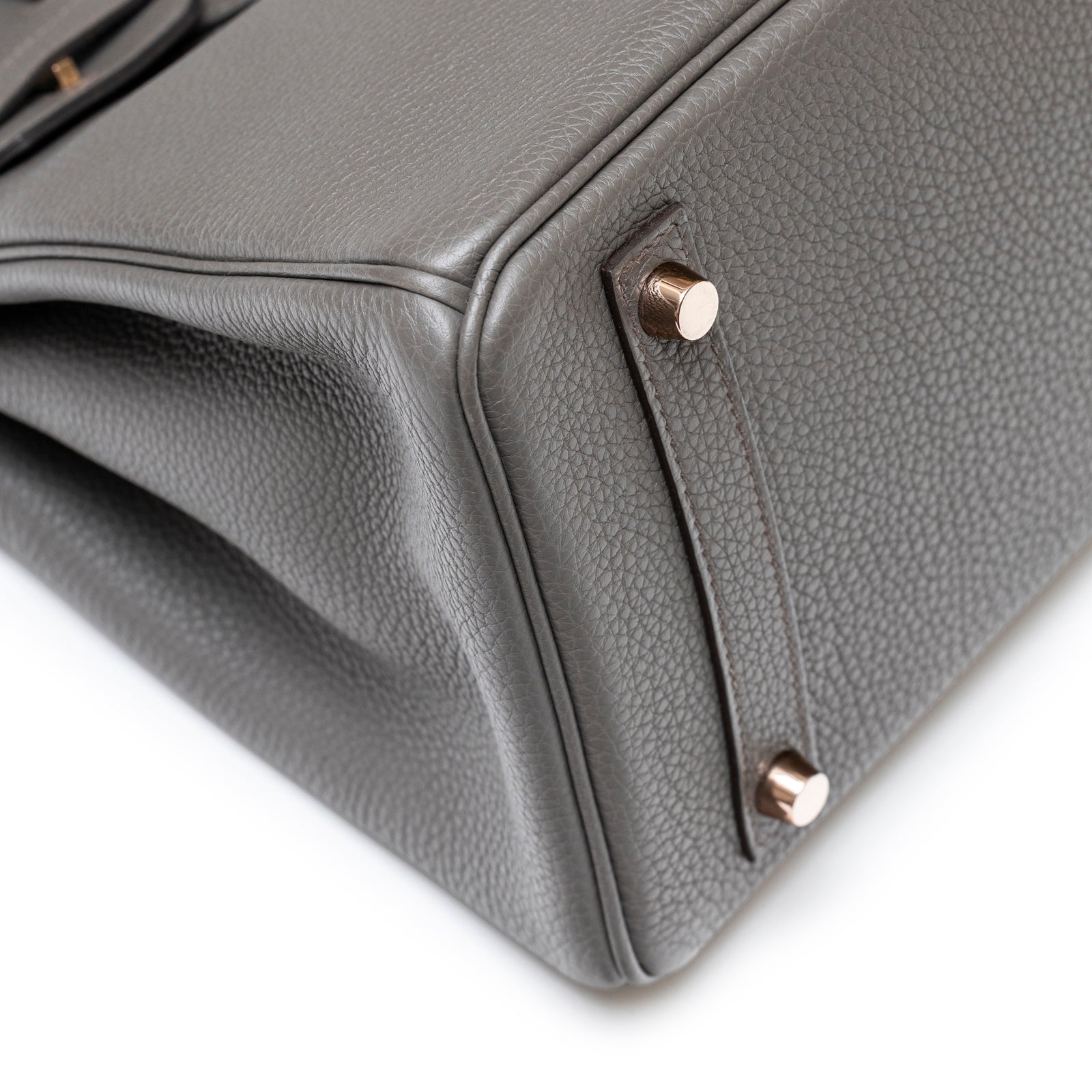 Close-up of bottom corner and rose gold hardware on Hermès Birkin 30 Etain Togo Rose Gold Hardware handbag