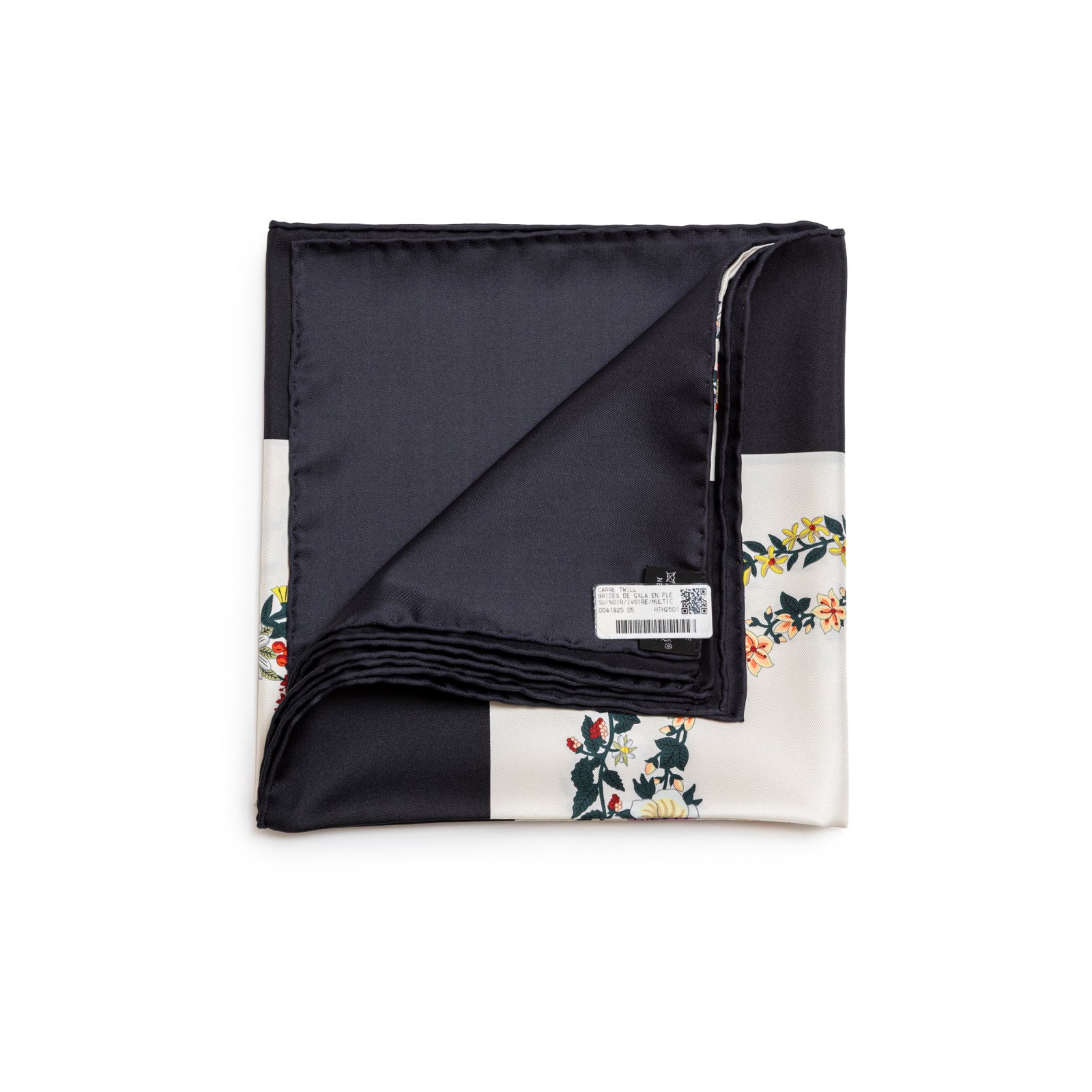 Folded Hermès Brides de Gala en Fleurs Scarf 90 Su Black Ivory Multi showing floral print and smooth black silk back