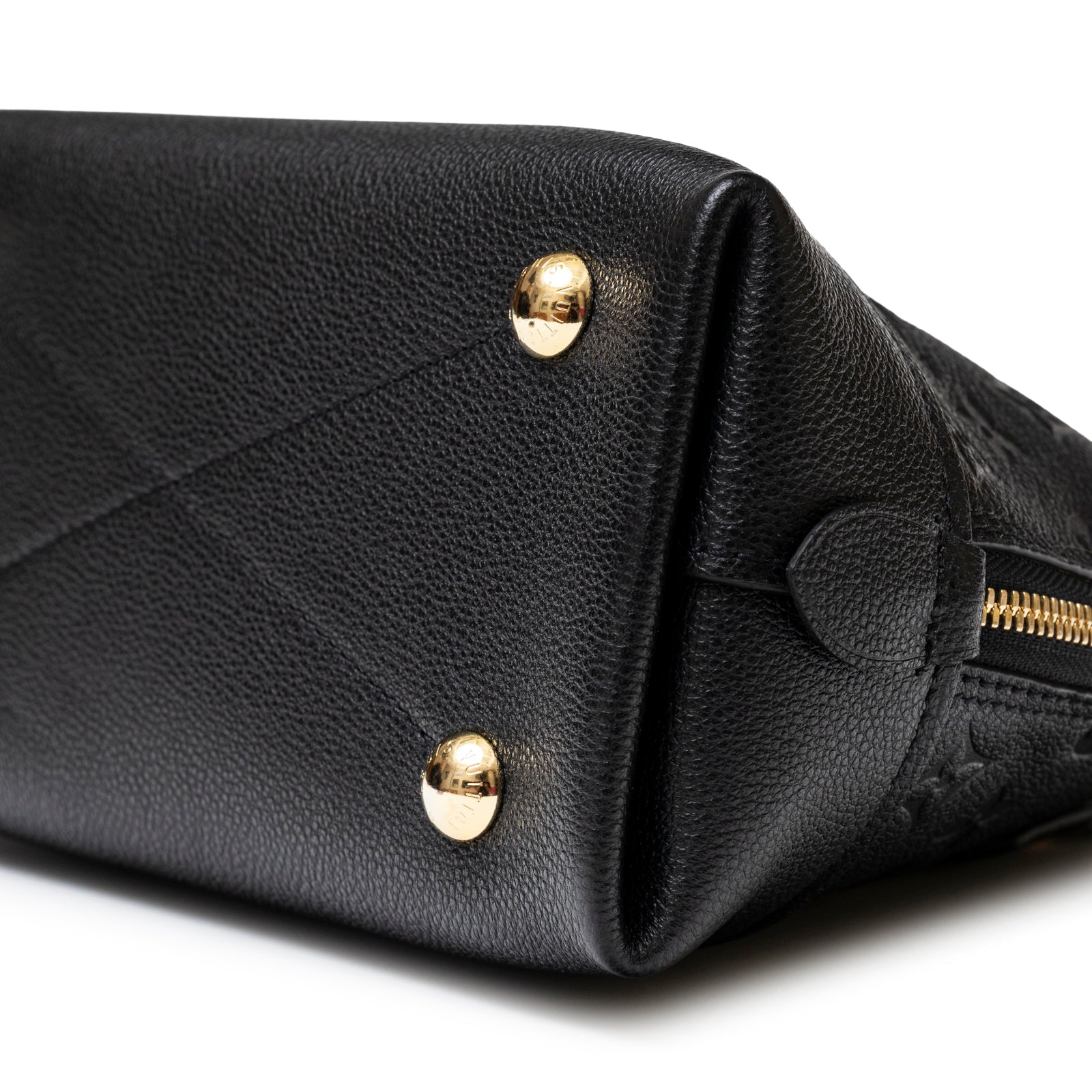 Close-up angled view of Louis Vuitton Neo Alma BB Monogram Empreinte Black Gold hardware corner base details