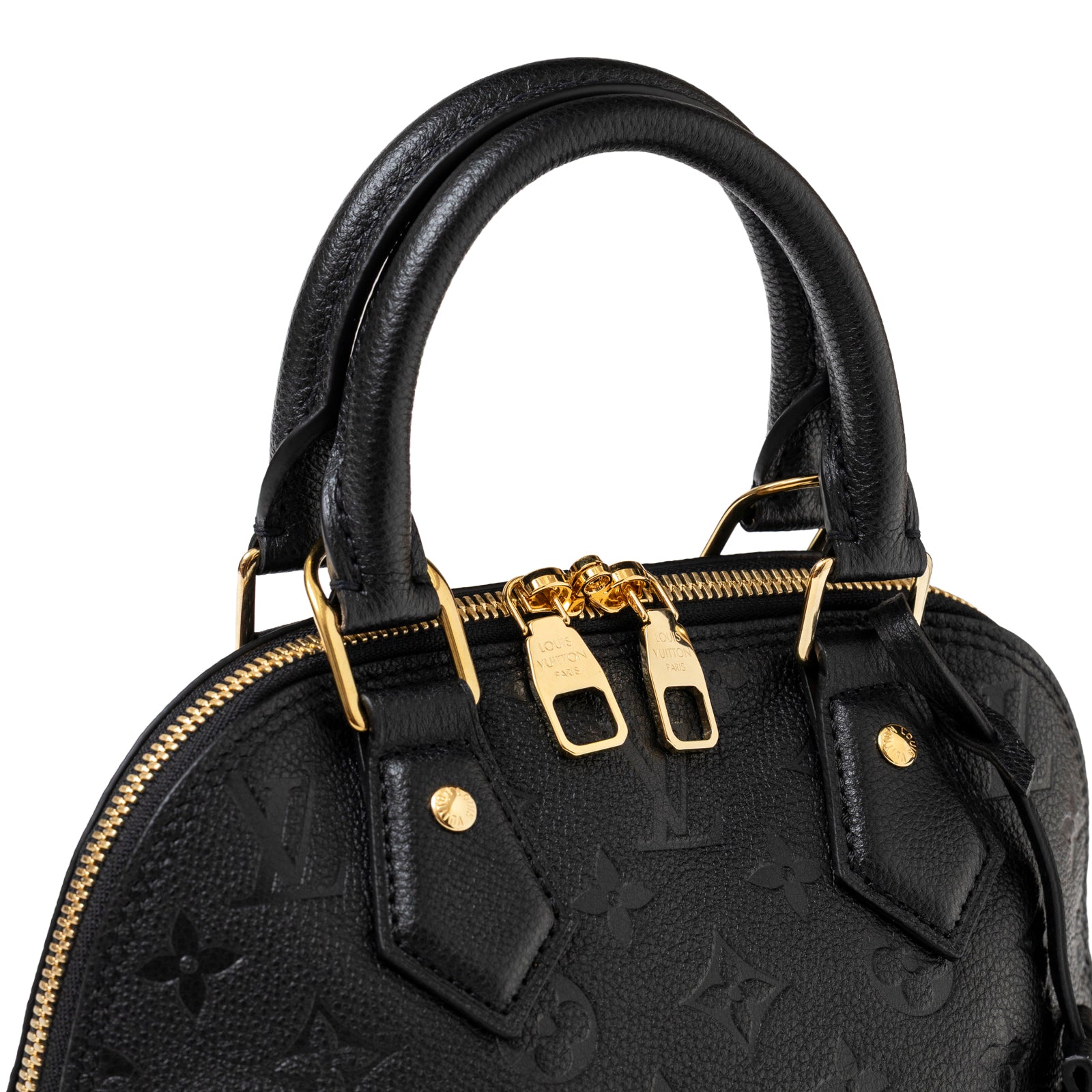 Close-up angled shot of Louis Vuitton Neo Alma BB Monogram Empreinte Black Gold hardware showing zipper and handle details