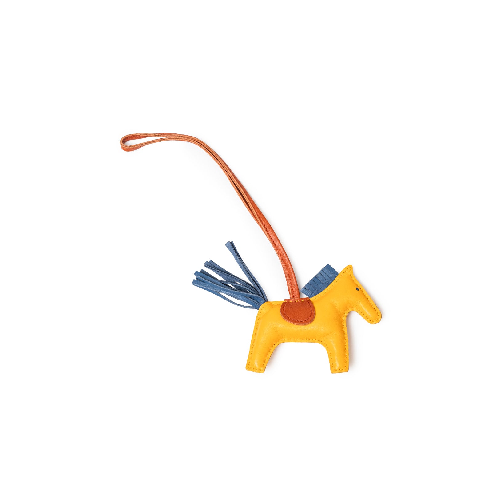 Top-down view of Hermès Rodeo PM Jaune D'or/Blue Agate/Cornaline leather horse charm with brown strap and blue tail detail