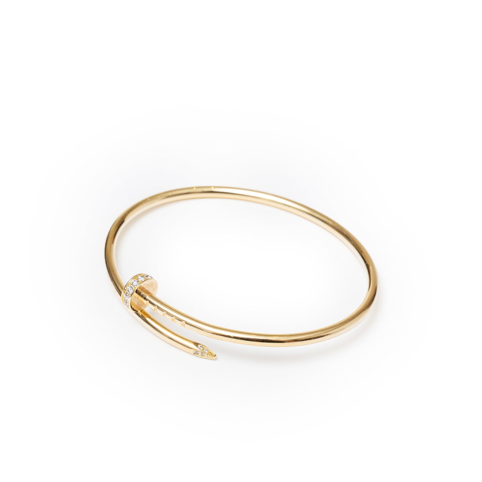 Angled view of Cartier Juste un Clou bracelet Small Model Yellow Gold Diamonds with diamond-encrusted nail head detail