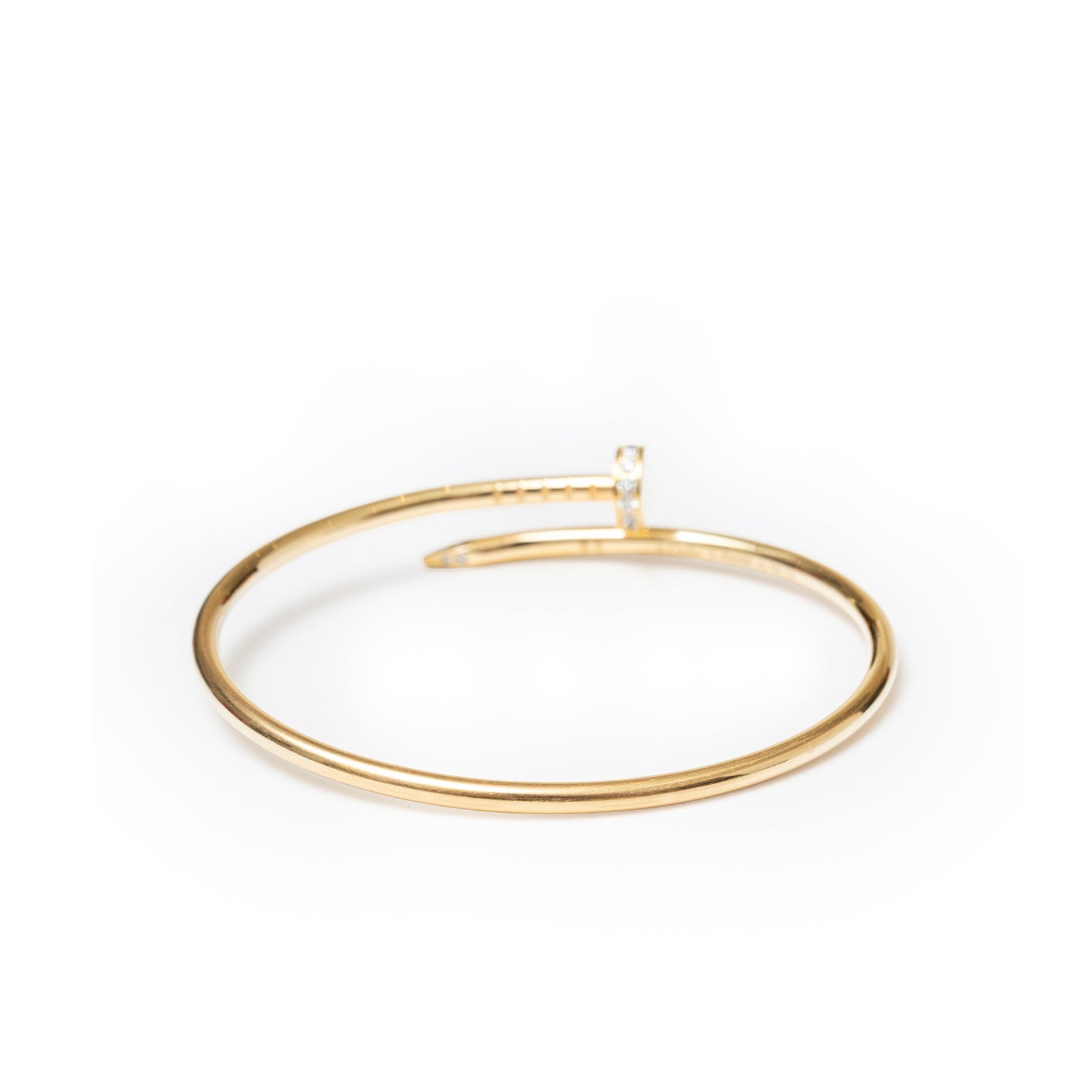 Angled close-up of Cartier Juste un Clou bracelet Small Model Yellow Gold/Diamonds showing sleek gold and diamond detail