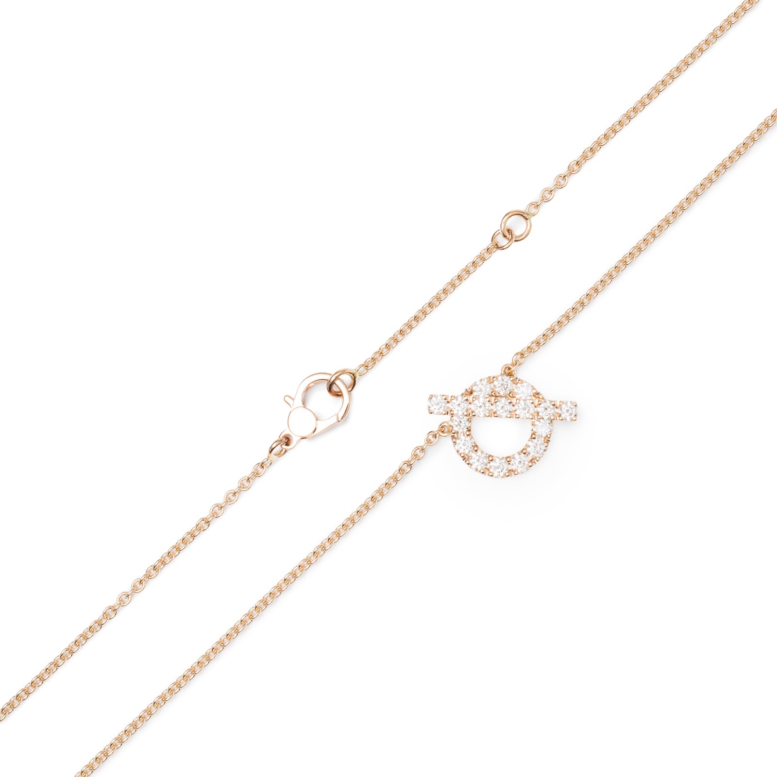 Close-up of Hermès Finesse Pendant Rose Gold Au750 chain and diamond-encrusted circular motif with clasp details