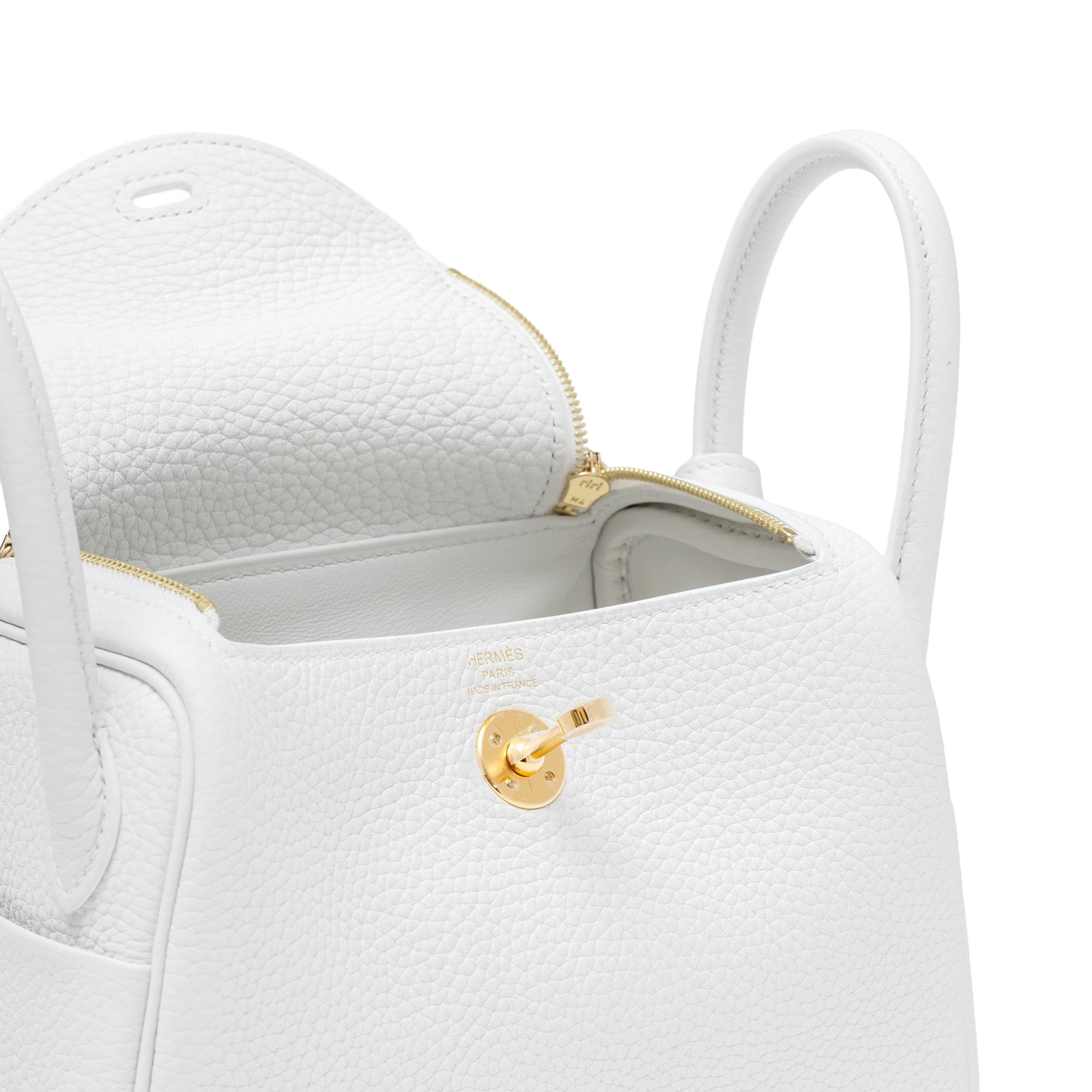 Close-up of Hermès Mini Lindy II New White Clemence Gold Hardware showing open top and textured leather interior