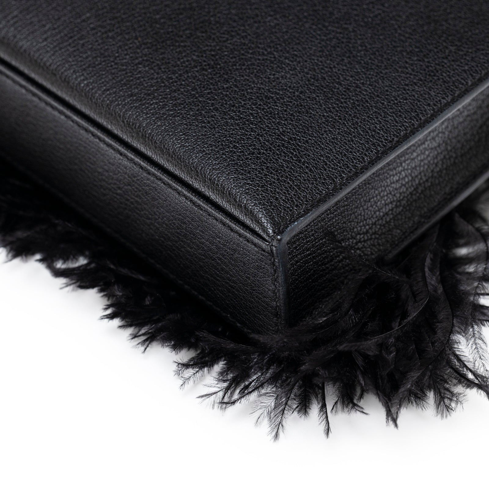 Back Corner of Hermès Kelly Elan Black Chevre Chamkila and Ostrich Feather Palladium Hardware clutch bag