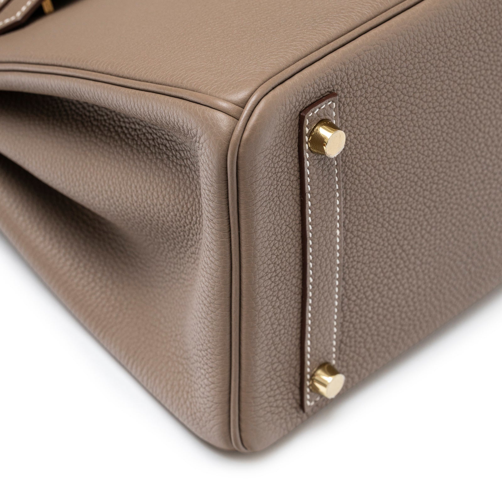 Close-up of bottom corner showing gold hardware and taupe textured leather on Hermès Birkin 30 Etoupe Togo Gold Hardware