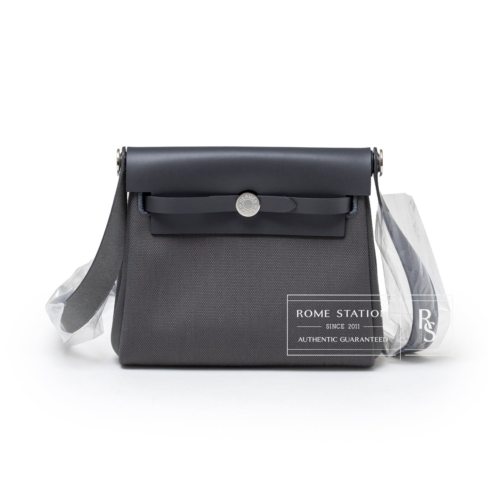 Front view of Hermès Mini Herbag Zip 20 Ardoise Toile and Vache Hunter Palladium Hardware with flap and strap details