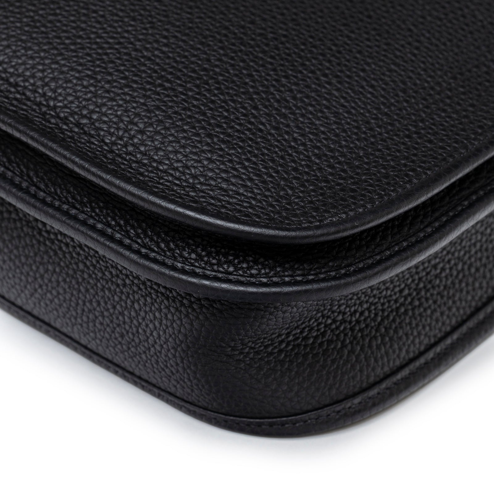 Close-up of black Clemence leather texture and stitching on Hermès Evelyne PM 29 Black Clemence Gold Hardware bag flap edge