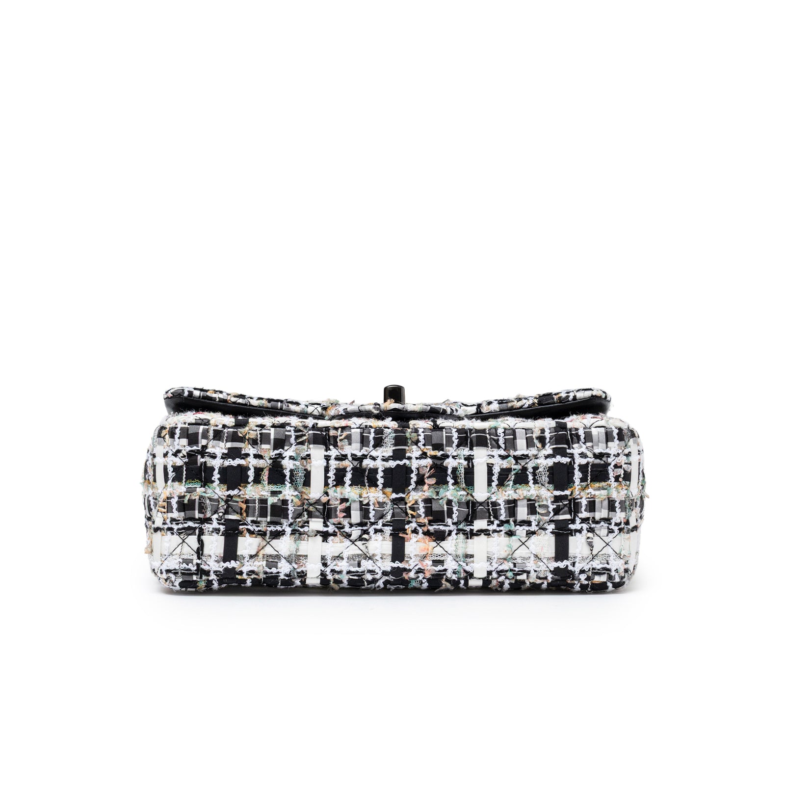 Bottom view of Chanel Mini Classic Flap Black and White Tweed Black Hardware showing textured tweed base and stitching details