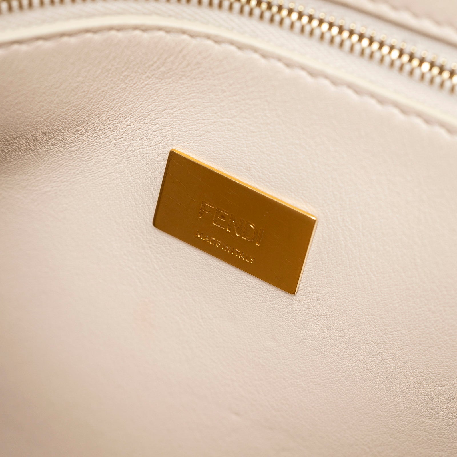 Close-up of gold hardware plaque inside Fendi Peekaboo ISeeU Small Tricolour Etoupe/Beige/Rose Calfskin Gold Hardware bag
