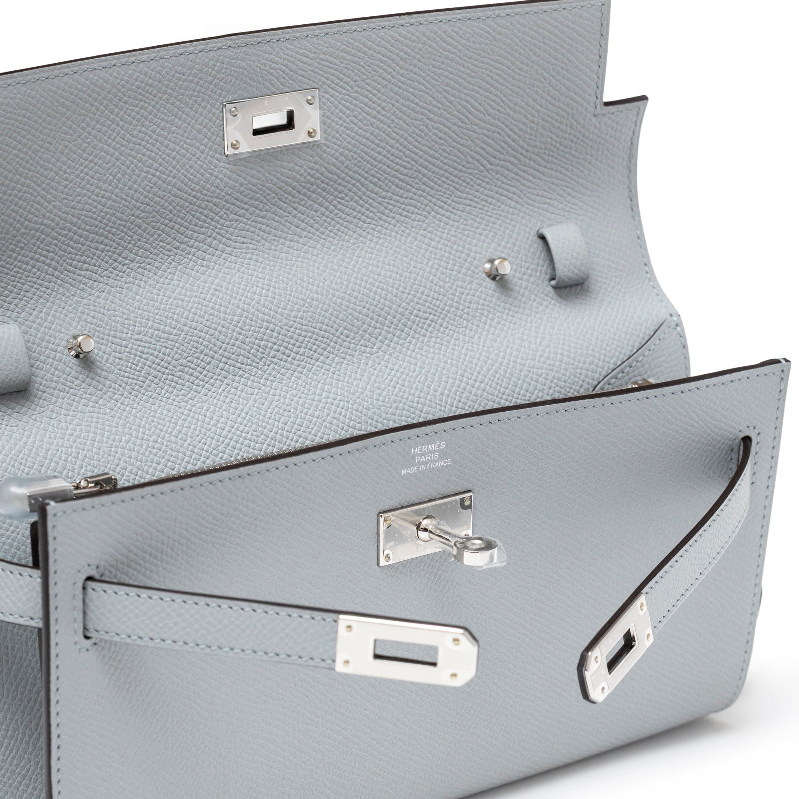 Close-up interior view of Hermès Kelly To Go Wallet Blue Glacier Epsom Palladium Hardware showing clasp and leather texture