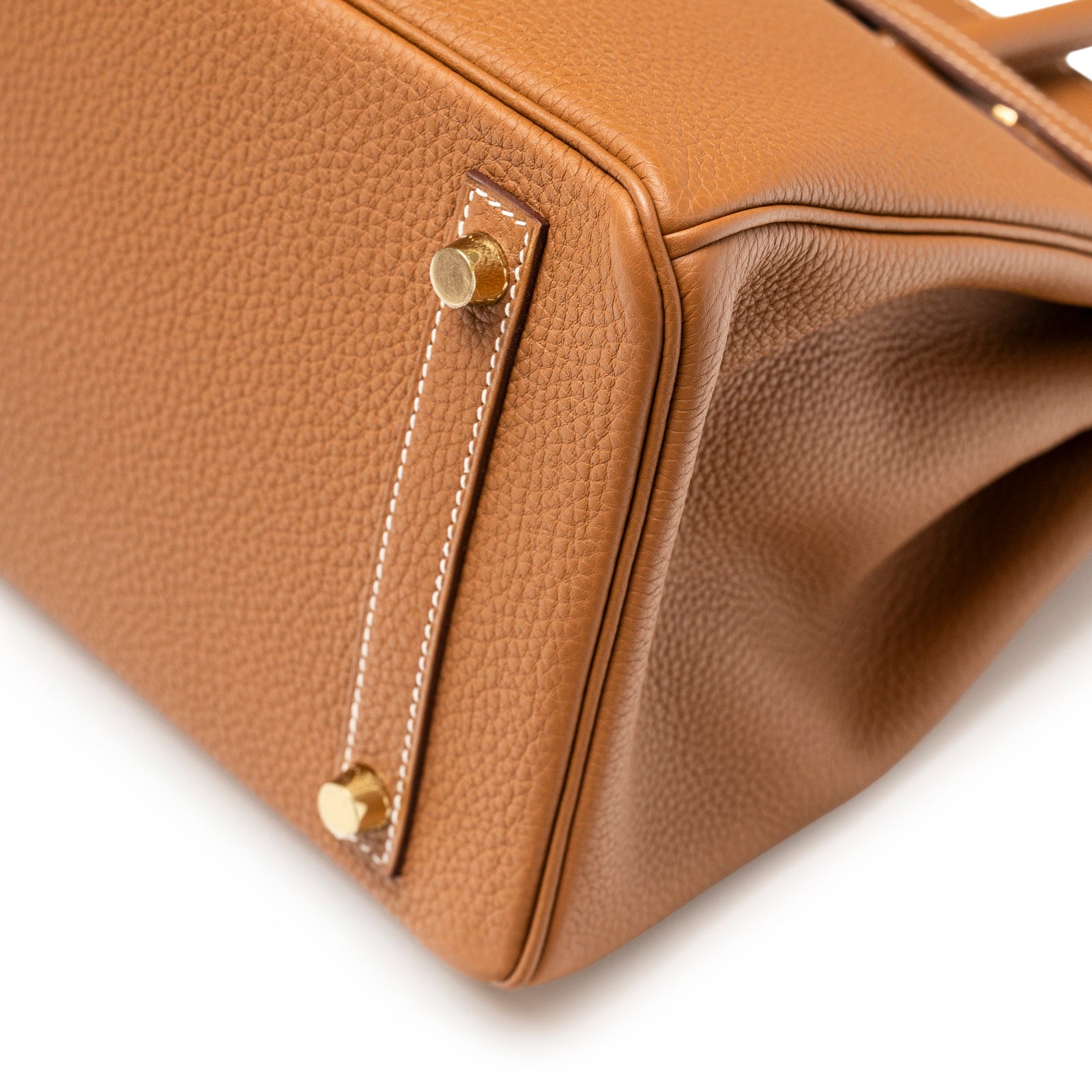 Close-up of bottom corner and gold hardware feet on Hermès Birkin 30 Gold Togo Gold Hardware bag