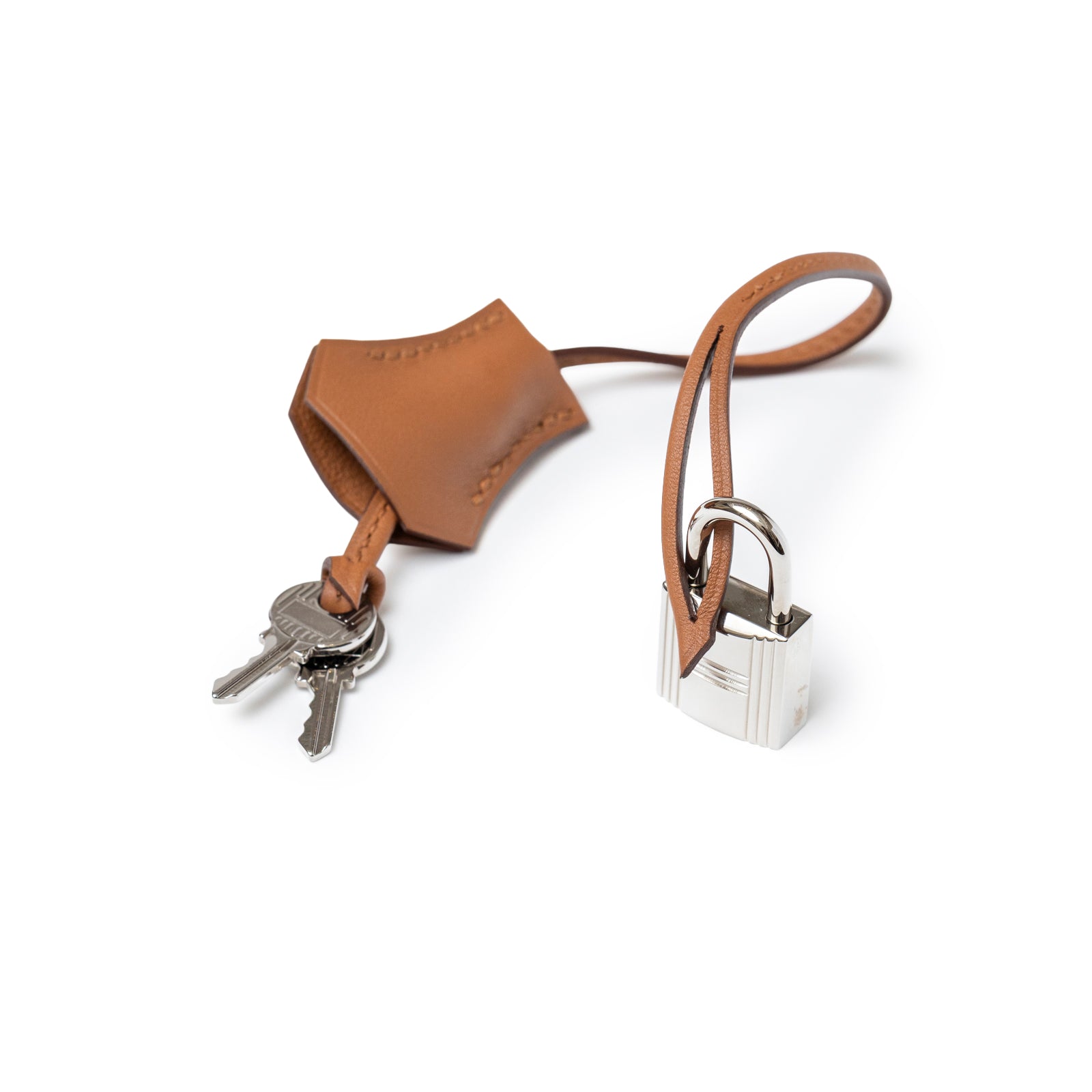 Close-up of palladium lock and leather clochette with keys for Hermès Birkin 30 Tressage Gold/Blue Du Nord/Blue Indigo Swift/Epsom Palladium Hardware