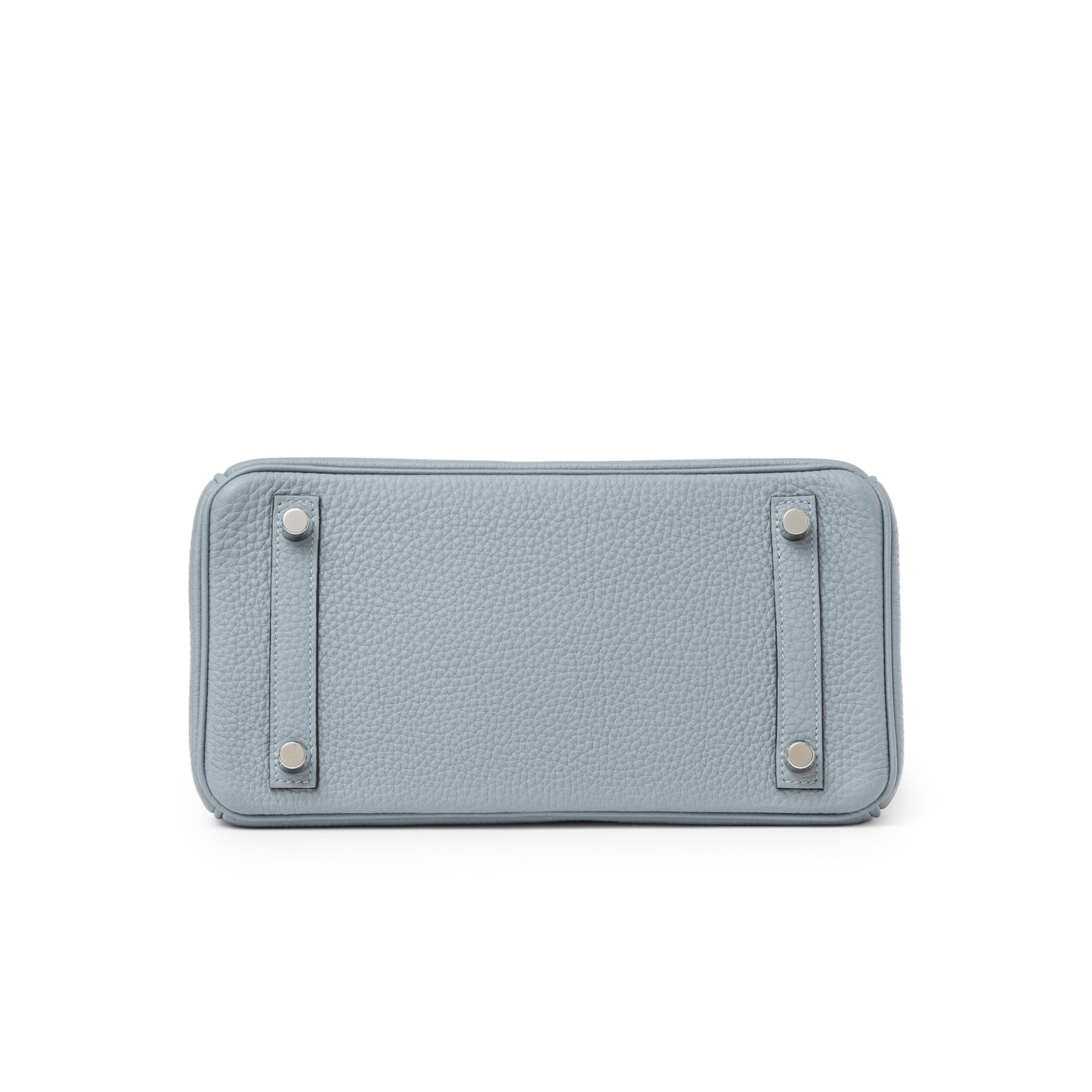Bottom view of Hermès Birkin 25 Blue Lin Verso Beige De Weimar Togo Palladium Hardware bag showing leather texture and metal feet
