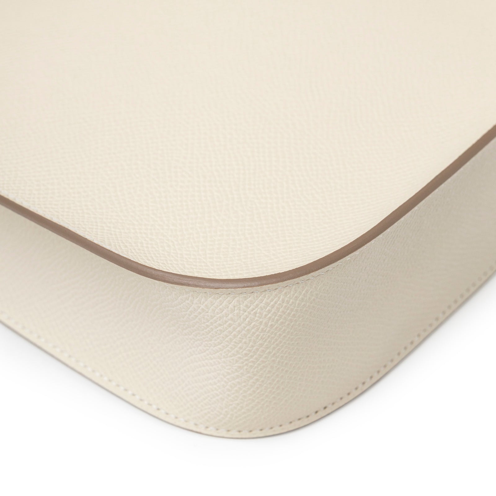 Close-up of Hermès Mini Evelyne Sellier Craie Epsom Gold Hardware showing texture and edge stitching detail