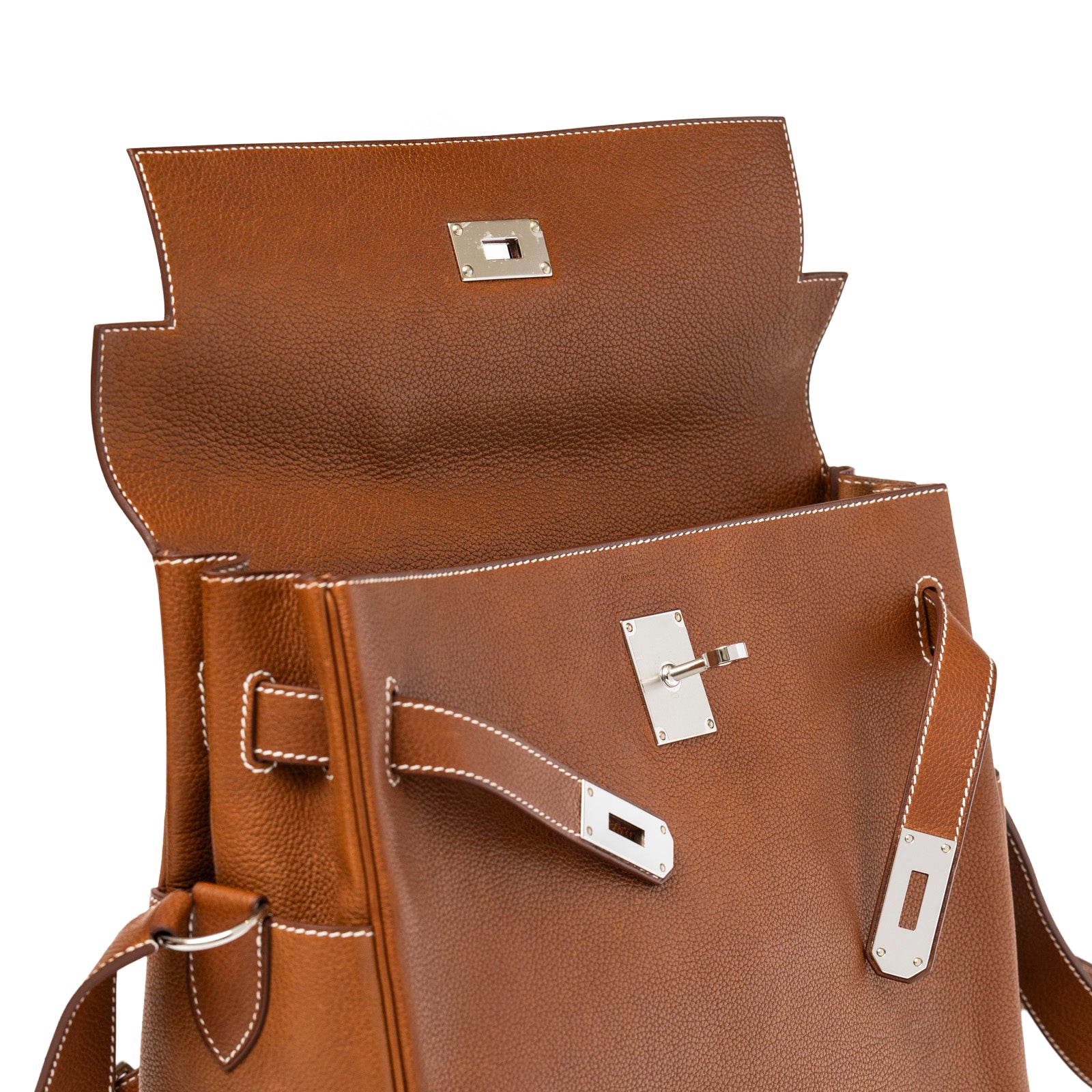 Open top view of Hermès Kelly Messenger GM Fauve Barenia Faubourg Palladium Hardware showing leather and palladium clasp detail