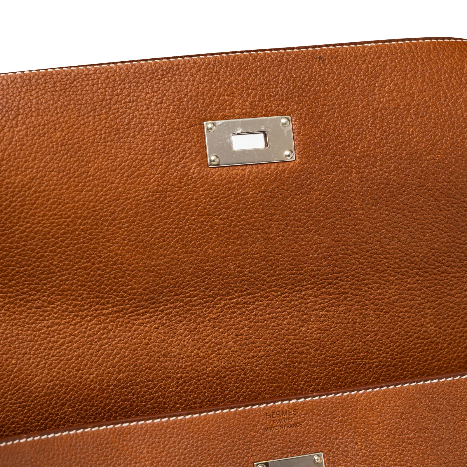 Close-up interior view of Hermès Kelly Messenger GM Fauve Barenia Faubourg Palladium Hardware leather texture and stitching detail