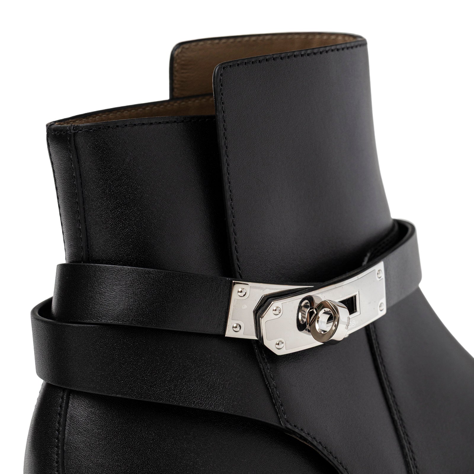 Close-up angled view of Hermès Kelly Neo Ankle Boot Black Palladium Plated showing smooth leather and metal clasp detail