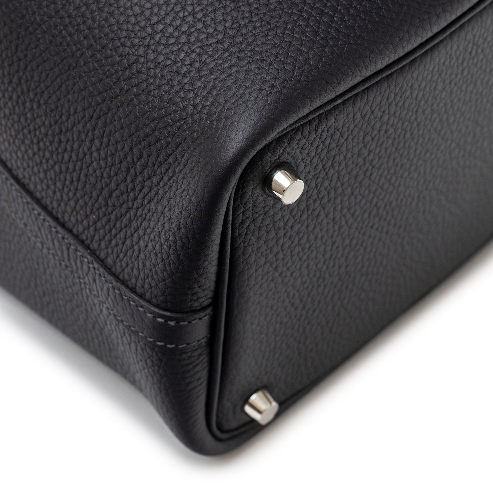 Close-up angled view of Hermès Picotin 18 Plomb Clemence Palladium Hardware bottom corner and stitching detail