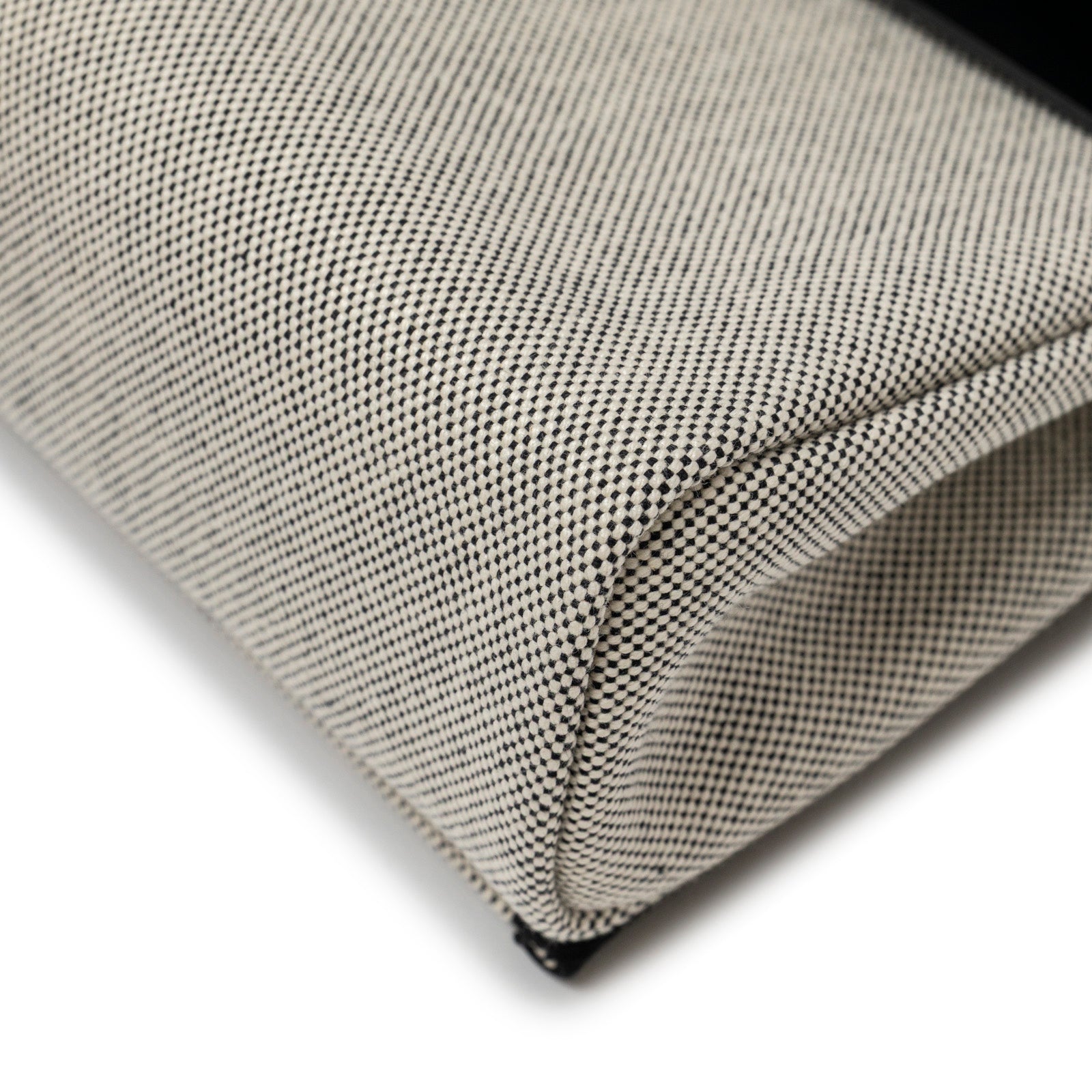 Close-up angled view of Hermès Mini Herbag Zip 20 Ecru/Black Toile and Vache Hunter Palladium Hardware corner detail