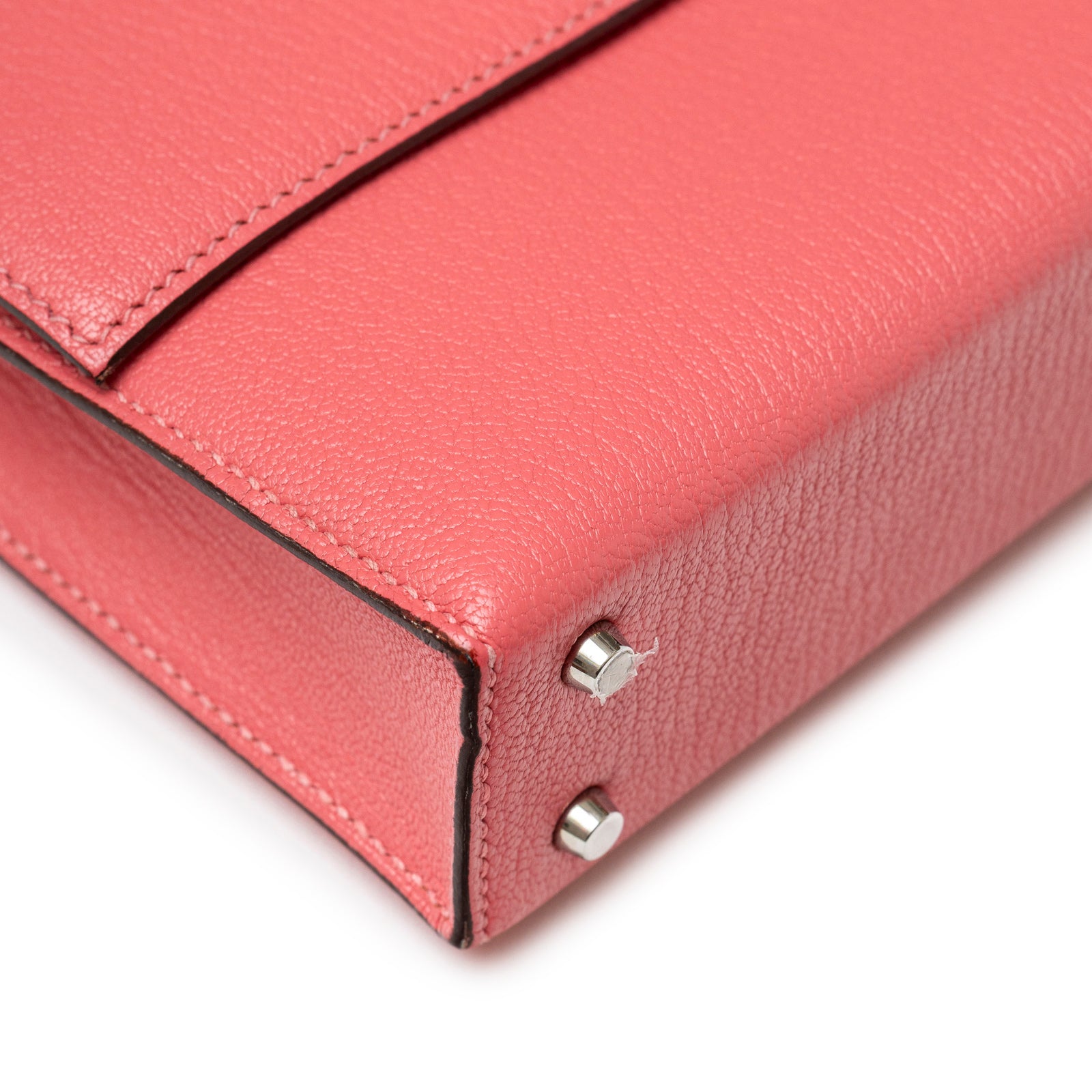 Close-up of corner and palladium hardware studs on Hermès Mini Verrou Chaine Bag Rose Azalee Chevre Mysore Palladium Hardware