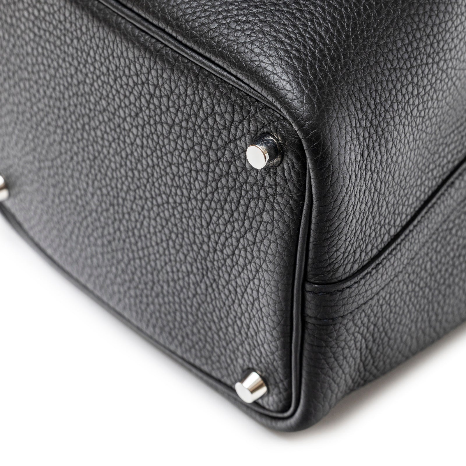 Close-up of bottom corner showing textured black leather and palladium hardware on Hermès Picotin 18 Black Clemence Palladium Hardware