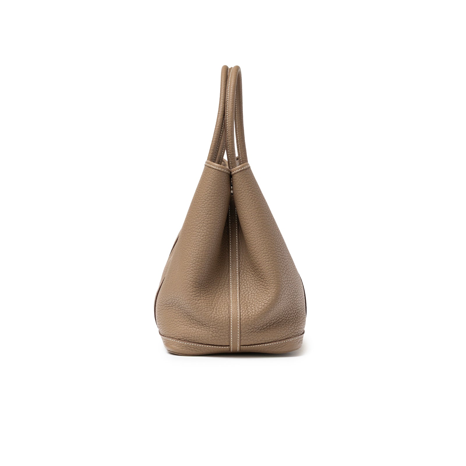 Side view of Hermès Garden Party 36 Etoupe Negonda Palladium Hardware with visible leather texture and handles