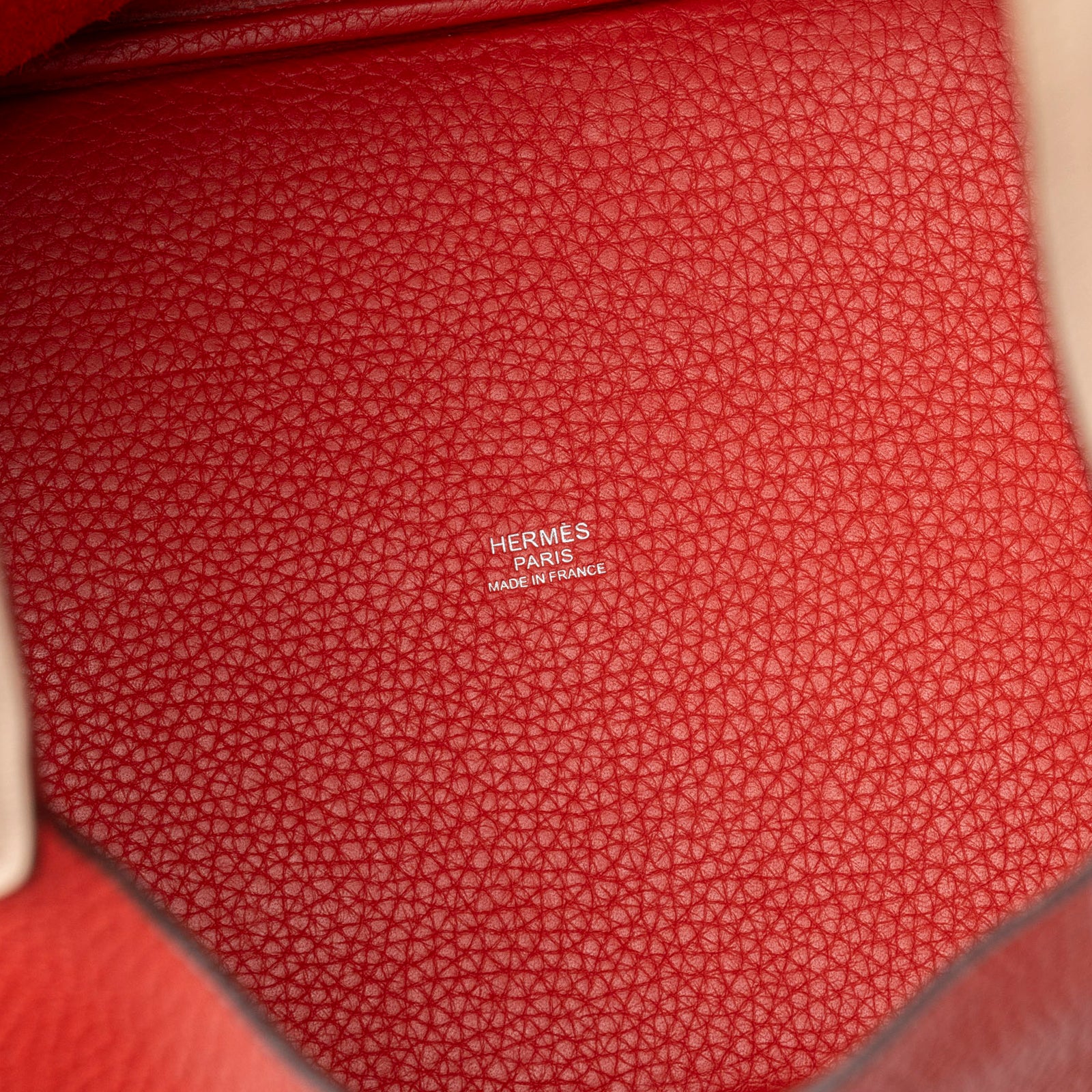 Close-up interior view of Hermès Picotin 22 Rouge Tomate Rose Elegante Clemence Palladium Hardware showing branding stamp