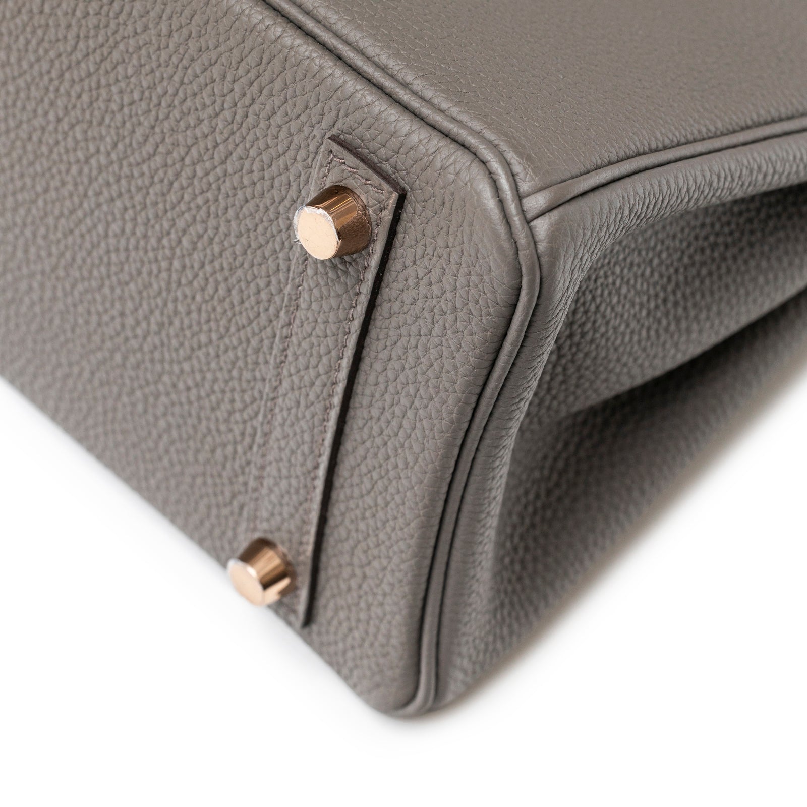 Close-up of base corner and rose gold hardware on Hermès Birkin 25 Etain Togo Rose Gold Hardware bag