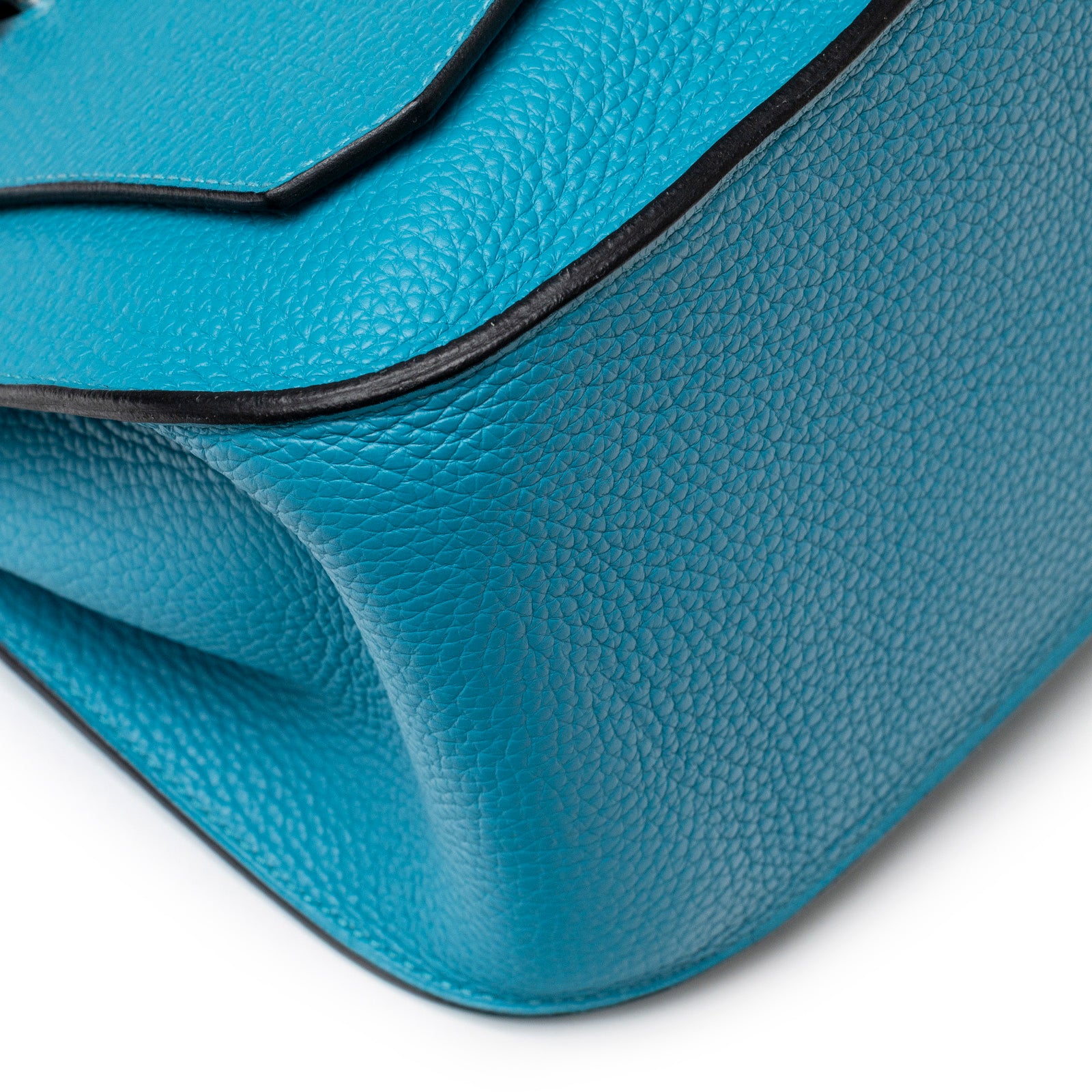 Close-up corner view of Hermès Jypsiere 31 Turquoise Clemence Palladium Hardware showing leather texture and edge detailing