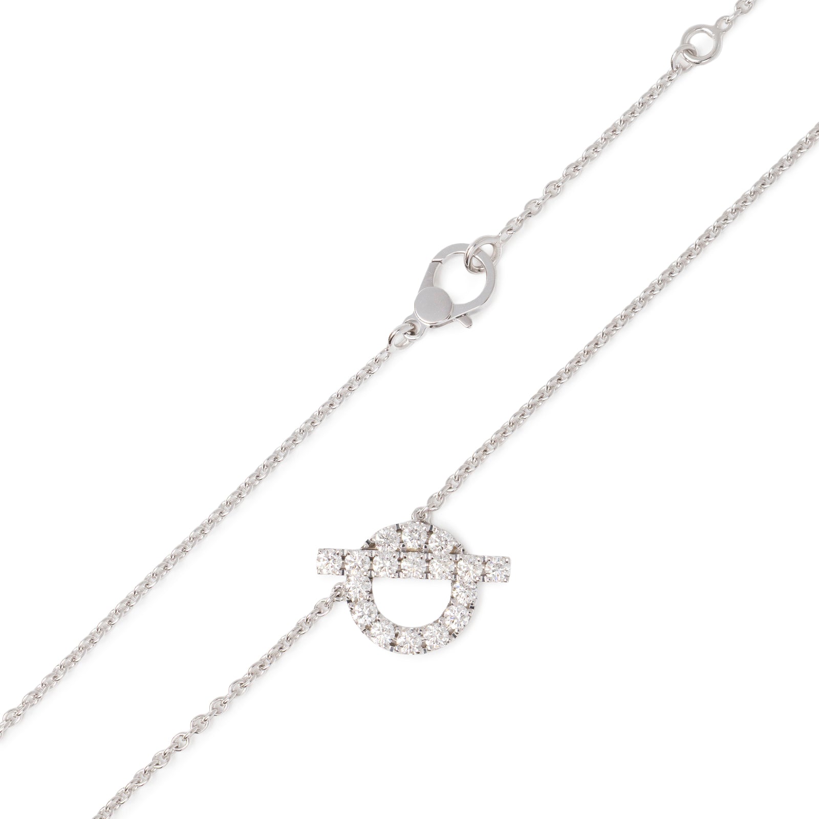 Close-up of Hermès Finesse Pendant Diamonds and 18k White Gold necklace clasp and diamond-encrusted pendant detail