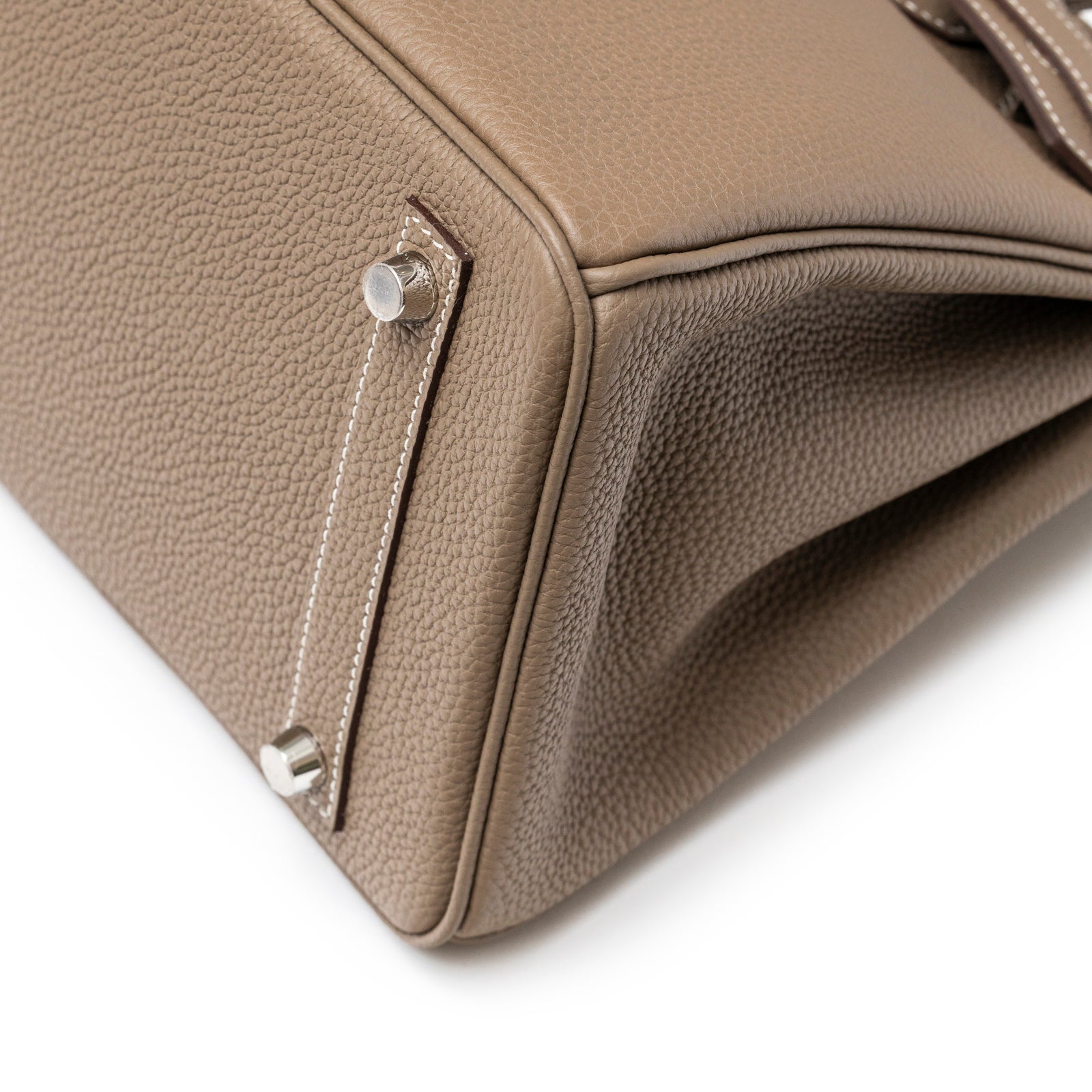 Close-up of bottom corner showing textured Etoupe Togo leather and palladium hardware of Hermès Birkin 30 Etoupe Togo Palladium Hardware