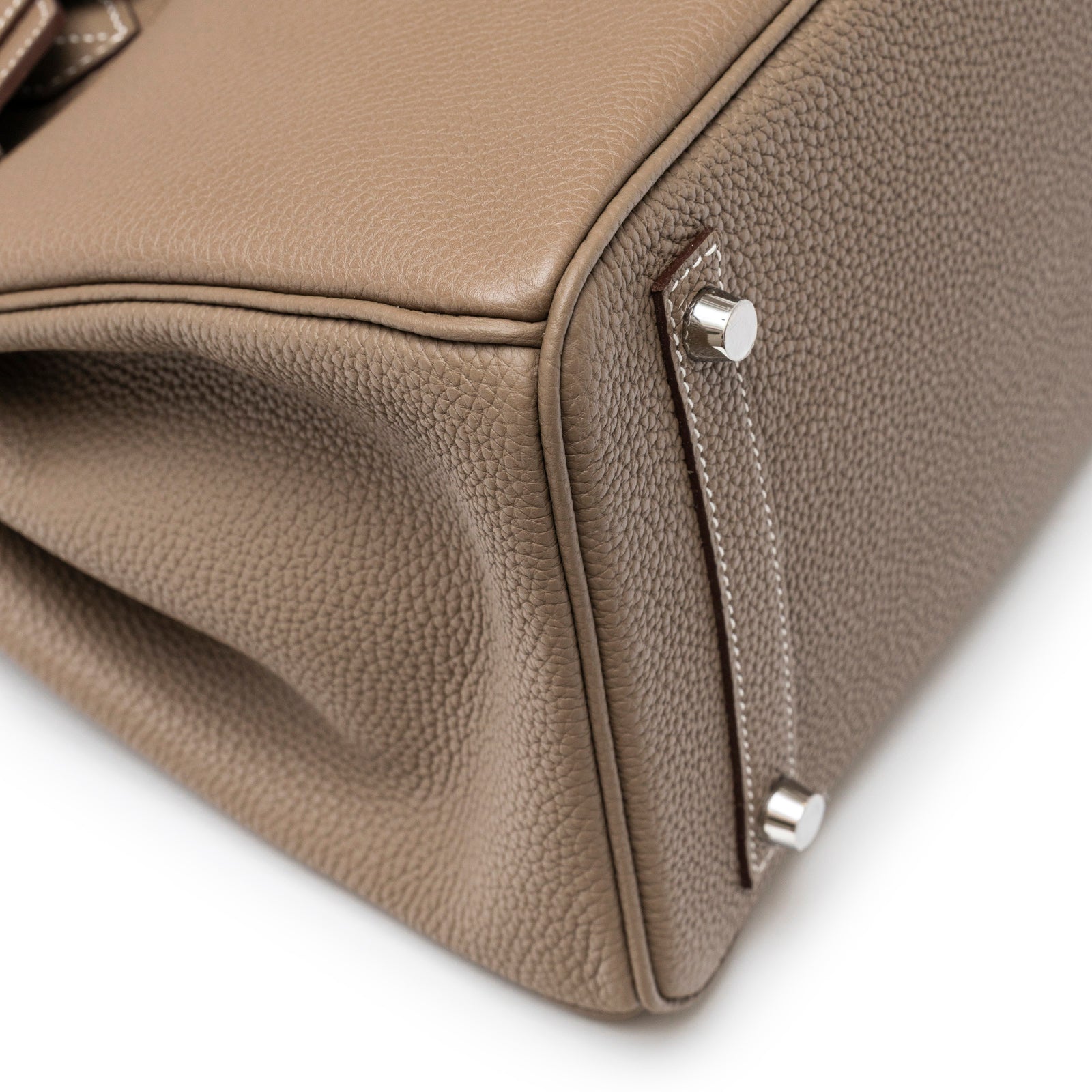 Close-up of bottom corner showing textured leather and palladium hardware on Hermès Birkin 30 Etoupe Togo Palladium Hardware