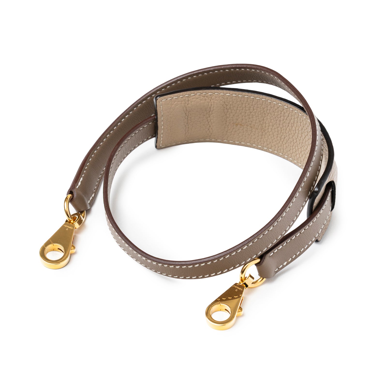 Hermès 24/24 29 Etoupe Togo and Swift Gold Hardware detachable shoulder strap angled view showing gold clasps and stitching