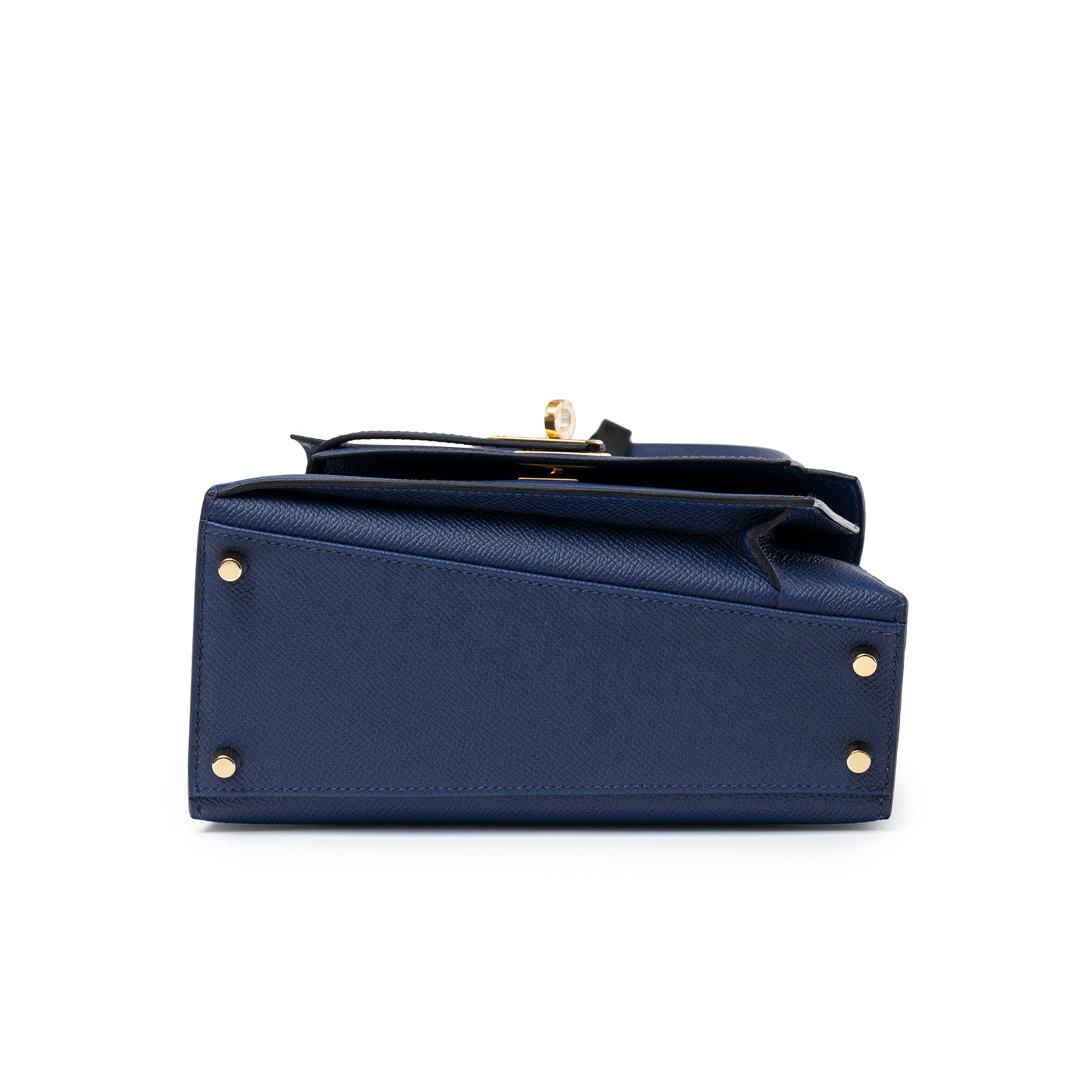 Bottom view of Hermès Kelly Desordre 20 Sellier Blue Saphir Epsom Gold Hardware showing base studs and textured leather