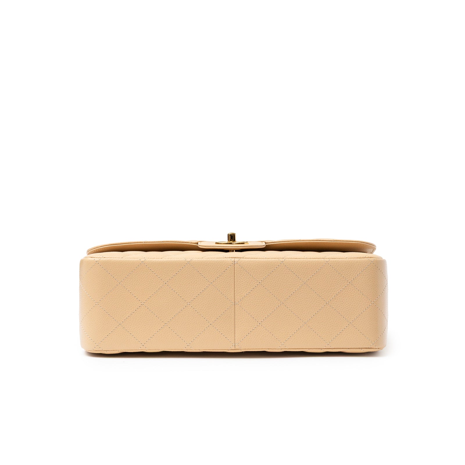 Bottom view of Chanel Classic Flap Jumbo Caviar Beige Gold Hardware showing quilted leather texture and stitching detail