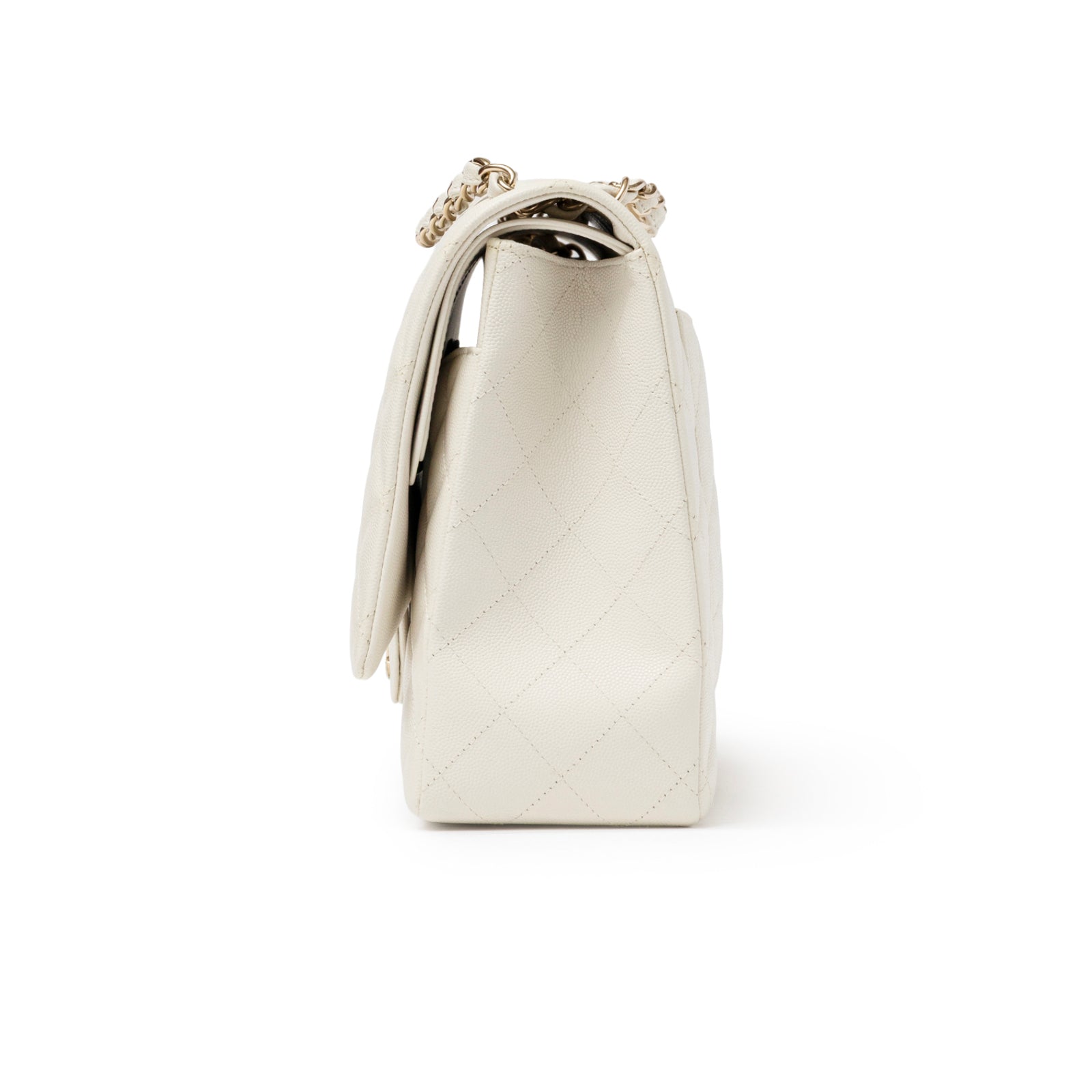 Side profile of Chanel Classic Flap Maxi Caviar White Gold Hardware in white quilted leather with chain strap