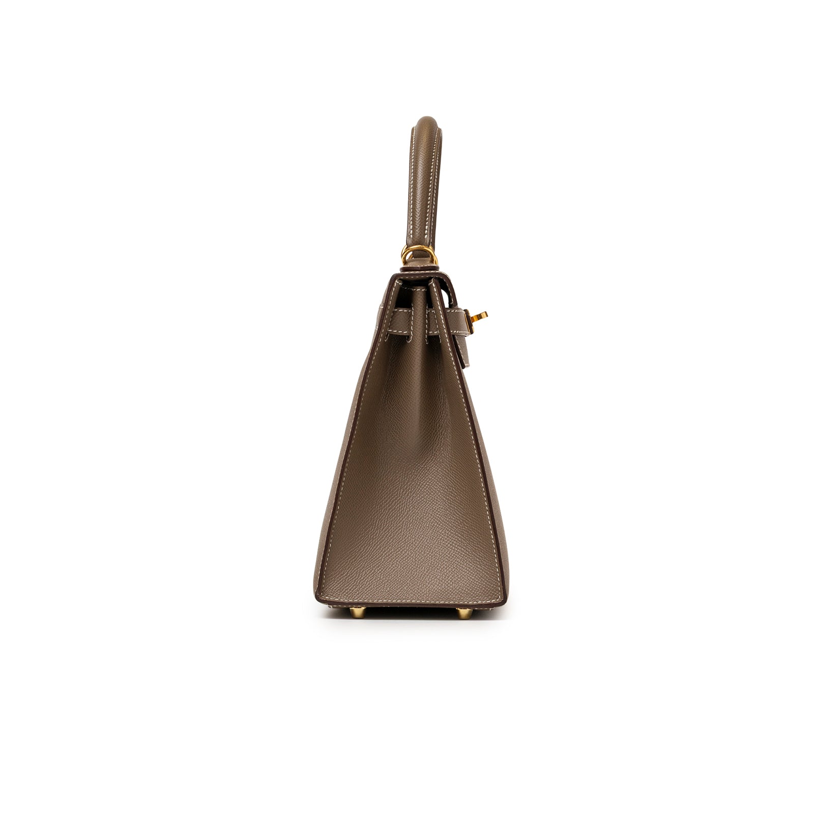 Side profile of Hermès Kelly 28 Sellier Etoupe Epsom Gold hardware showing structured silhouette and handle details