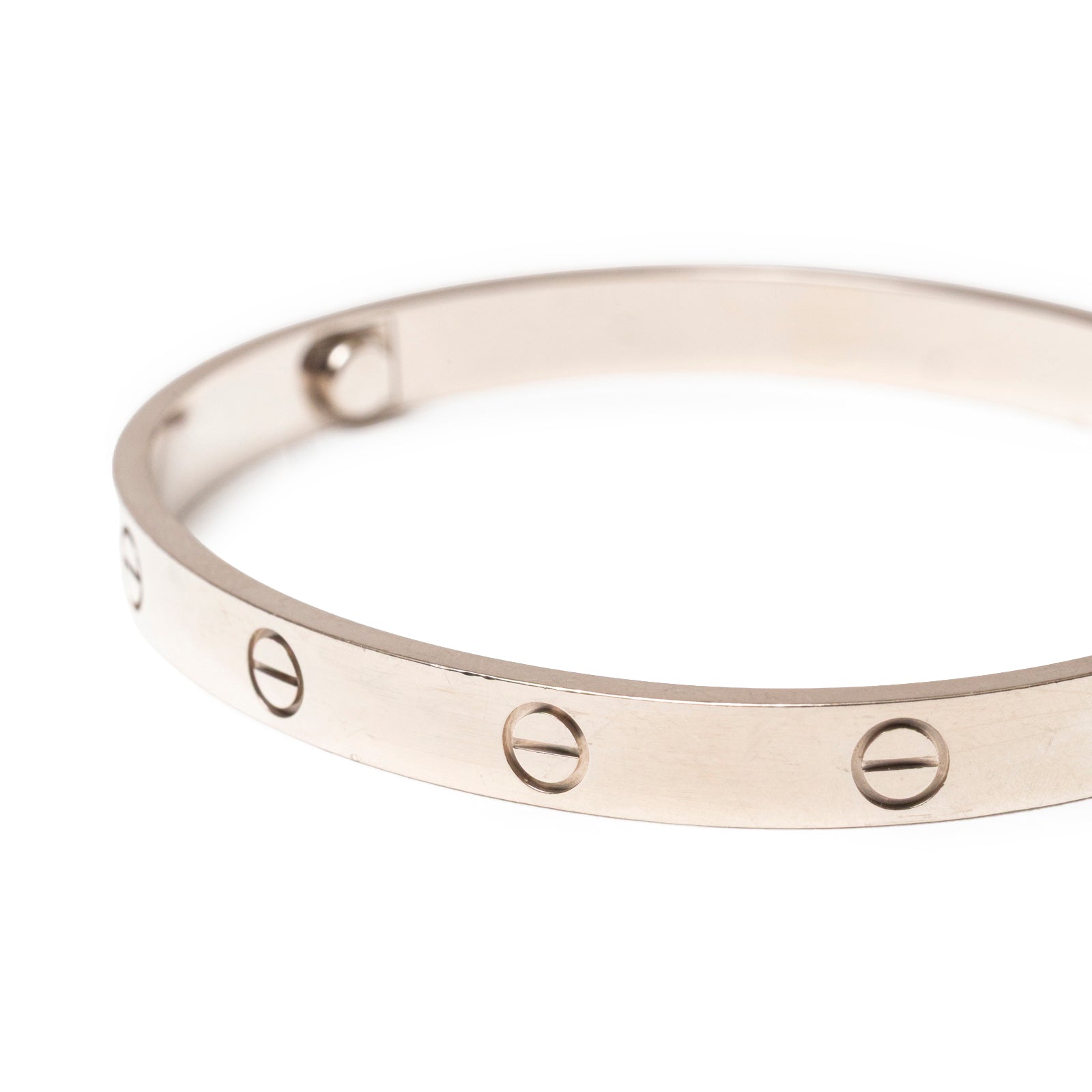 Close-up of Cartier Love Bracelet Classic Model 18K White Gold showing engraved screw motifs on round band