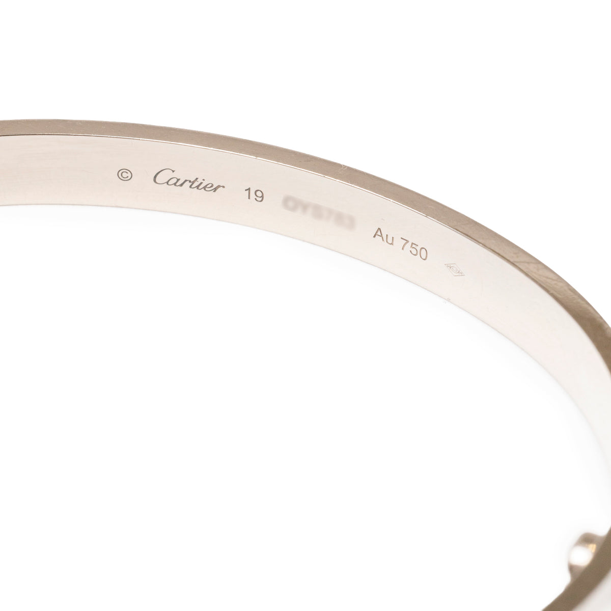 Close-up of inner engraving on Cartier Love Bracelet Classic Model 18K White Gold band